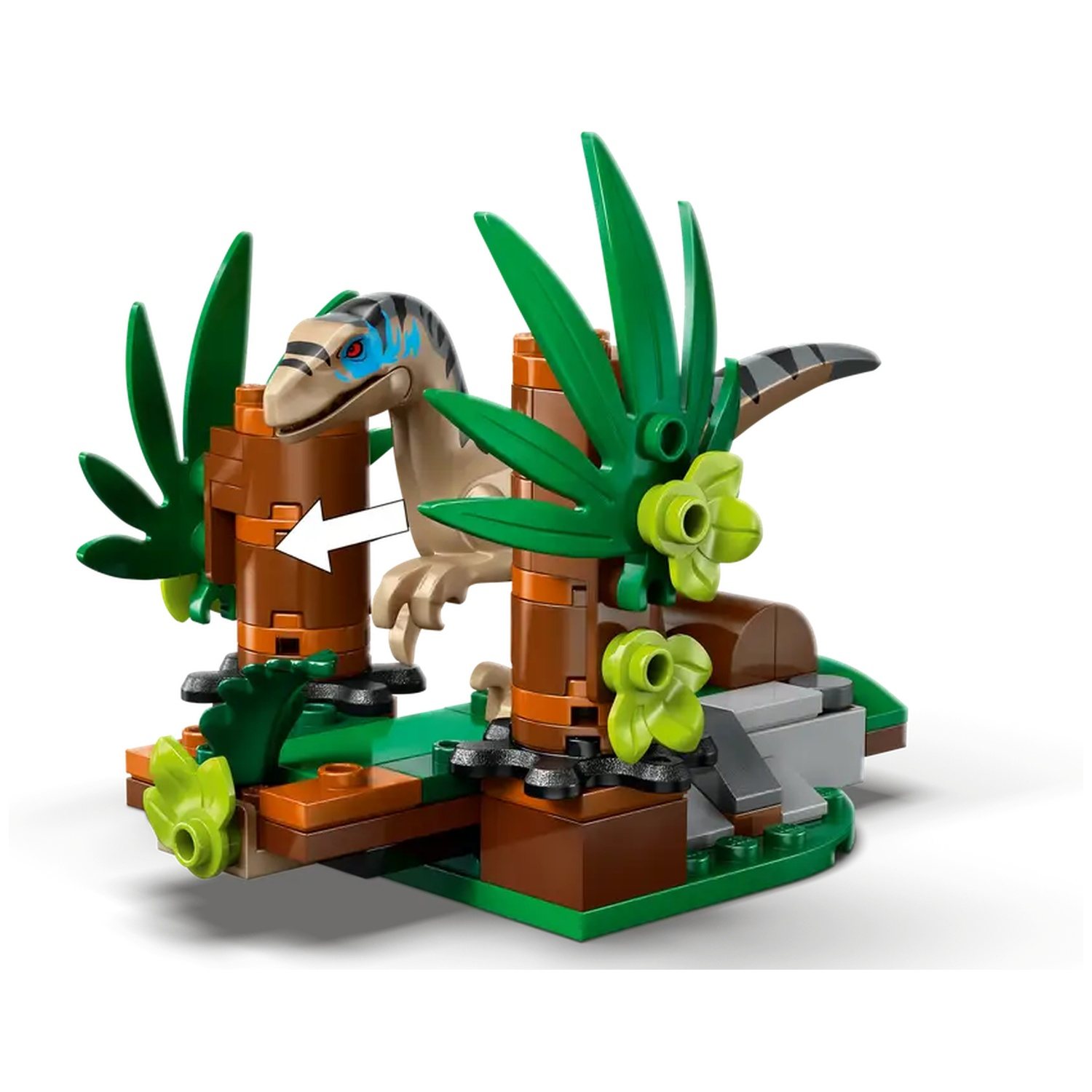 A Lego set featuring a tan dinosaur with blue markings, surrounded by brown structures and green foliage on a green base.