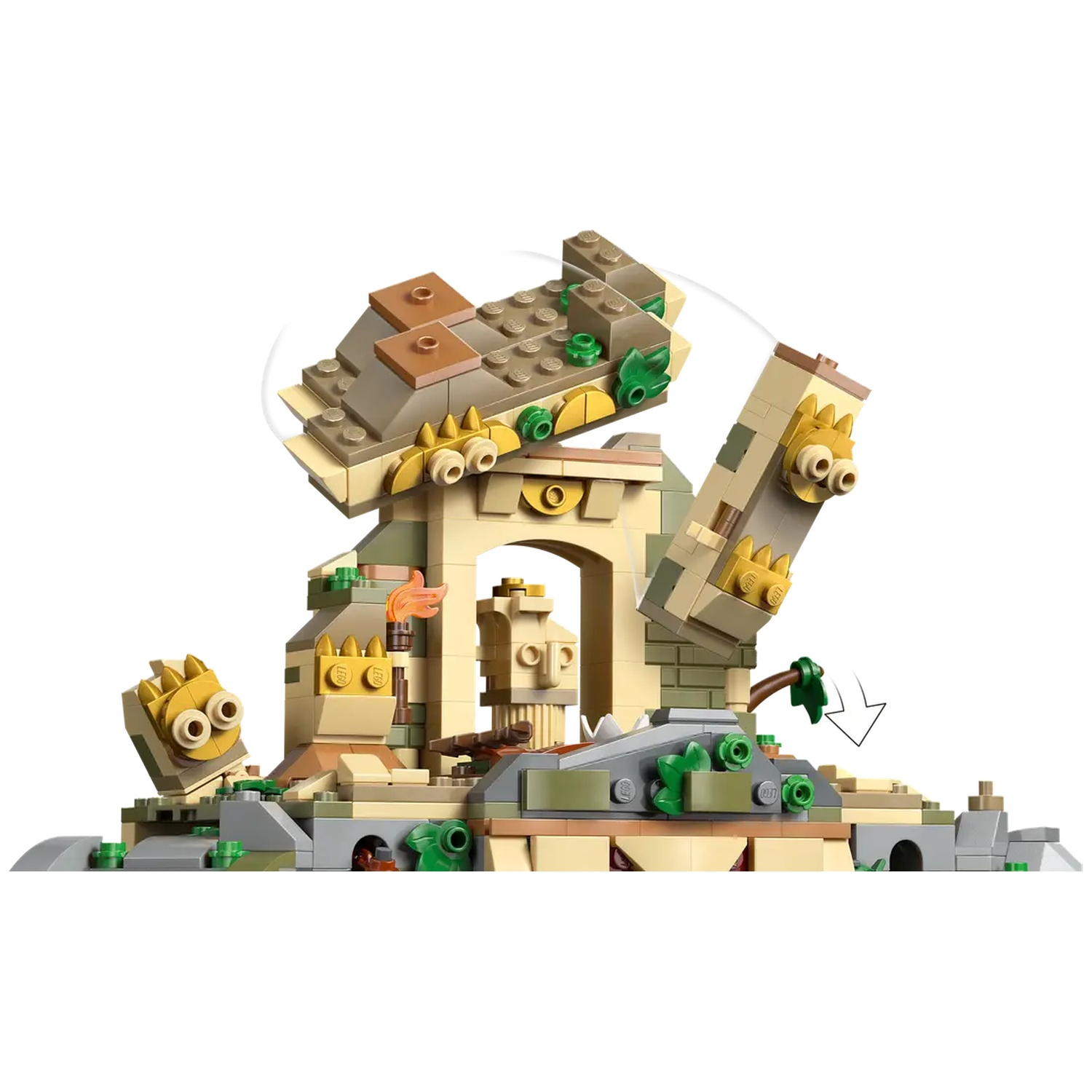 Lego set depicting a crumbling structure with archway, falling pieces, and decorative elements. Includes a torch and foliage.