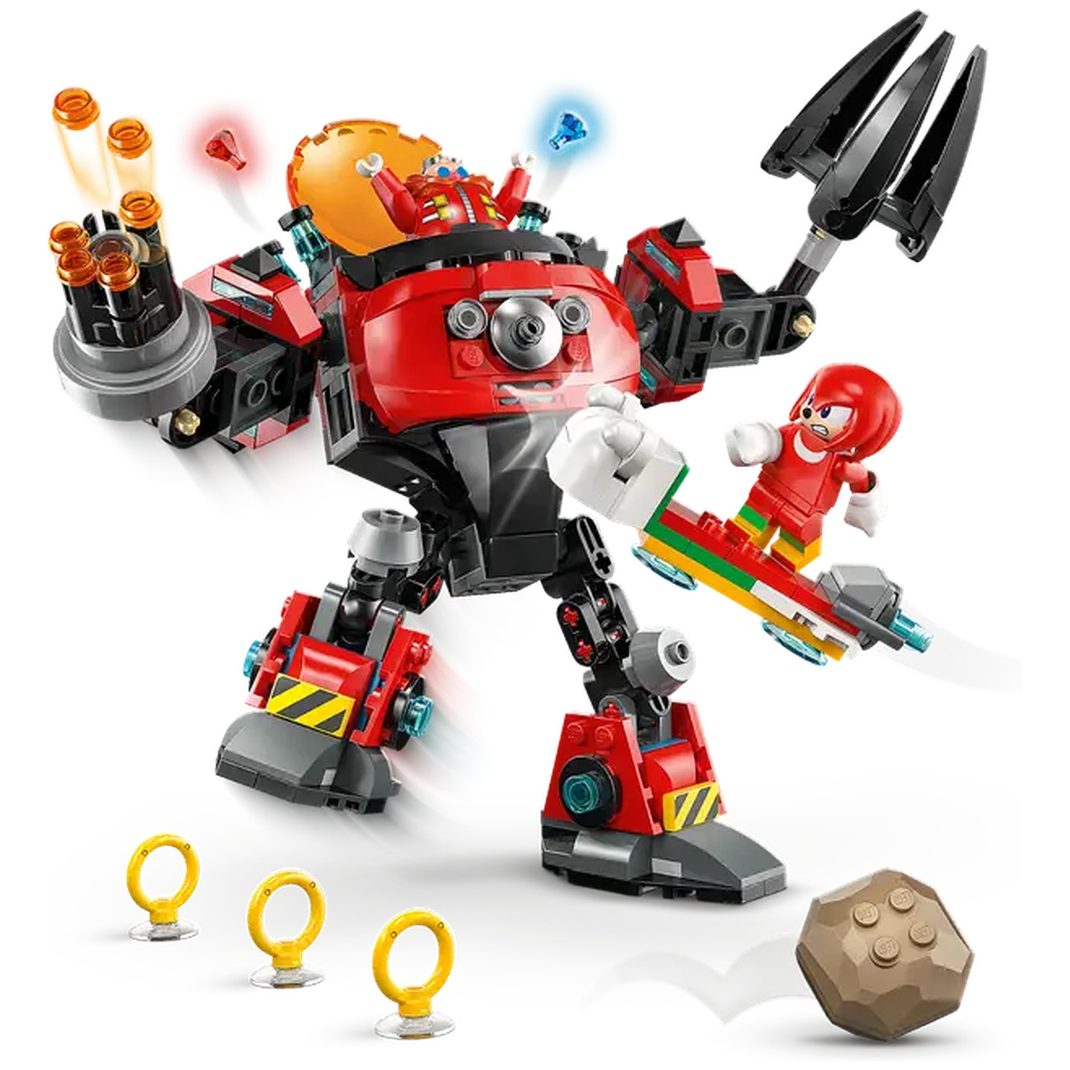 Ensemble Lego avec un robot rouge avec Eggman, Knuckles sur une planche et des anneaux. Un rocher est lancé vers le robot.