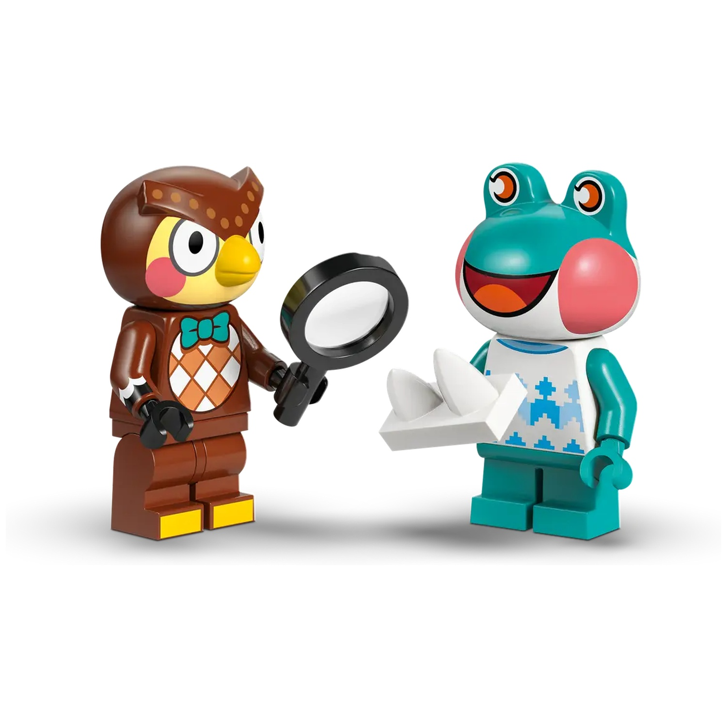 Deux figurines Lego : un hibou tenant une loupe et une grenouille tenant un objet blanc. Les deux sourient. Fond blanc.