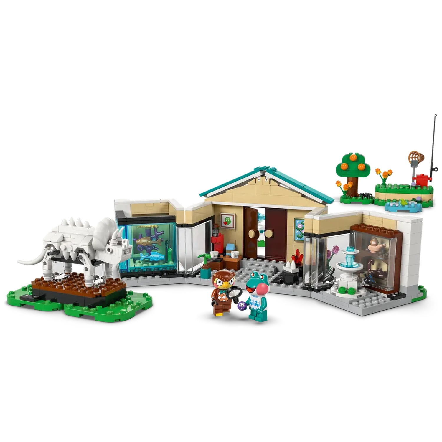 Une scène de jeu Lego présente un squelette de dinosaure, un bâtiment avec des aquariums et des figurines de hibou et de grenouille.