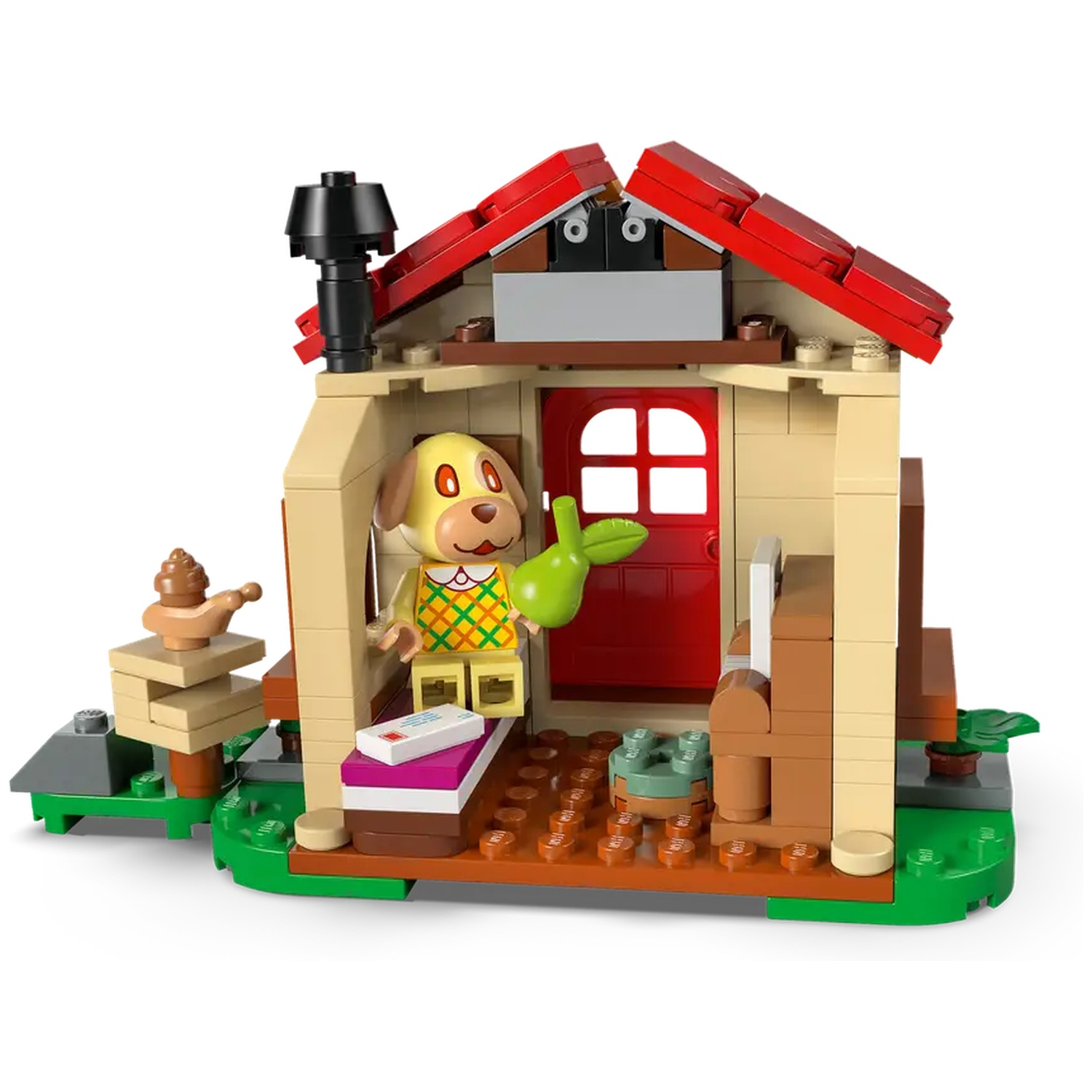 Une figurine de chien Lego tient une feuille verte, dans une maison Lego avec une porte et un toit rouges. Il y a une cheminée.