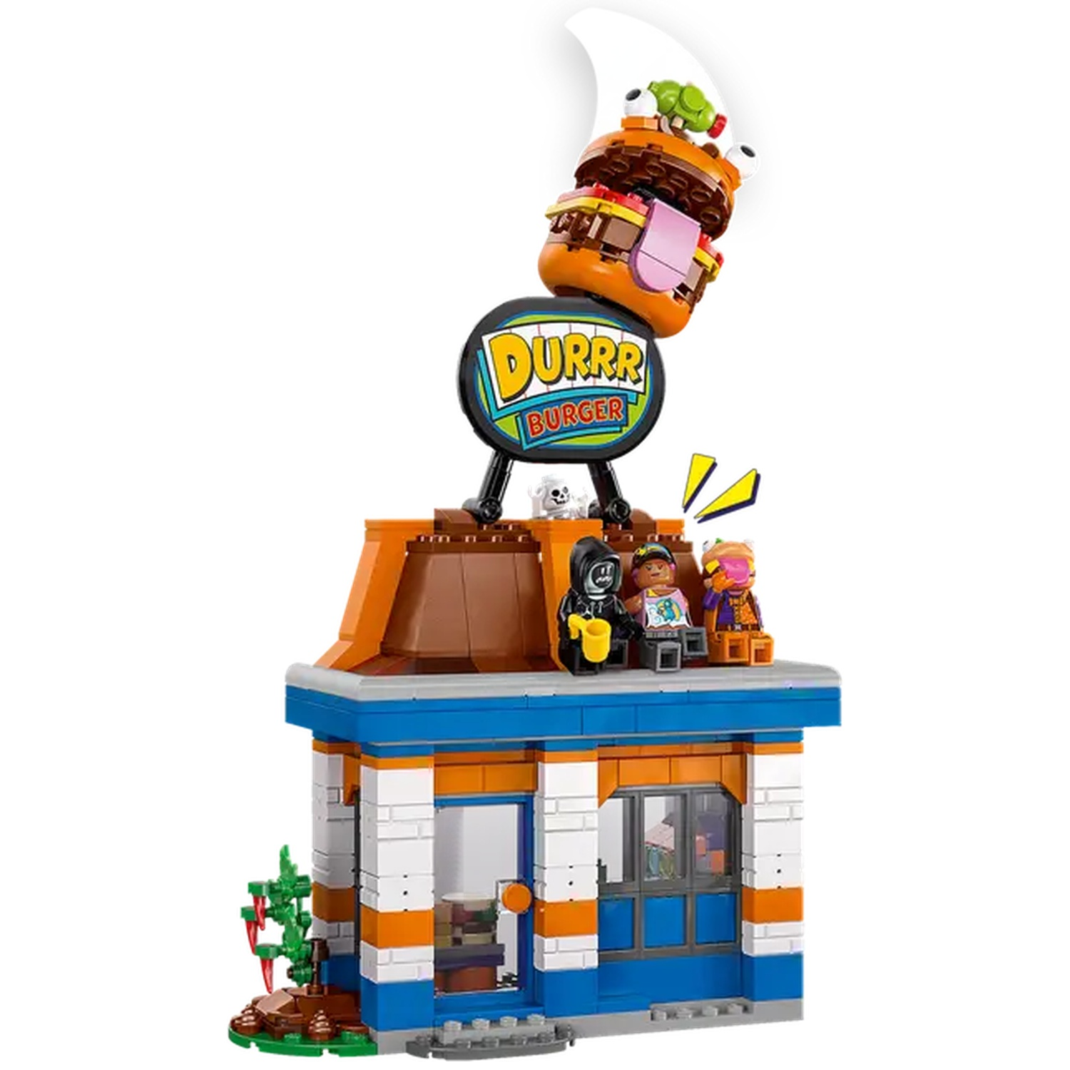 Restaurant Lego Durrr Burger avec des figurines sur le toit. Une enseigne de burger est au-dessus du bâtiment et un gros burger au sommet.