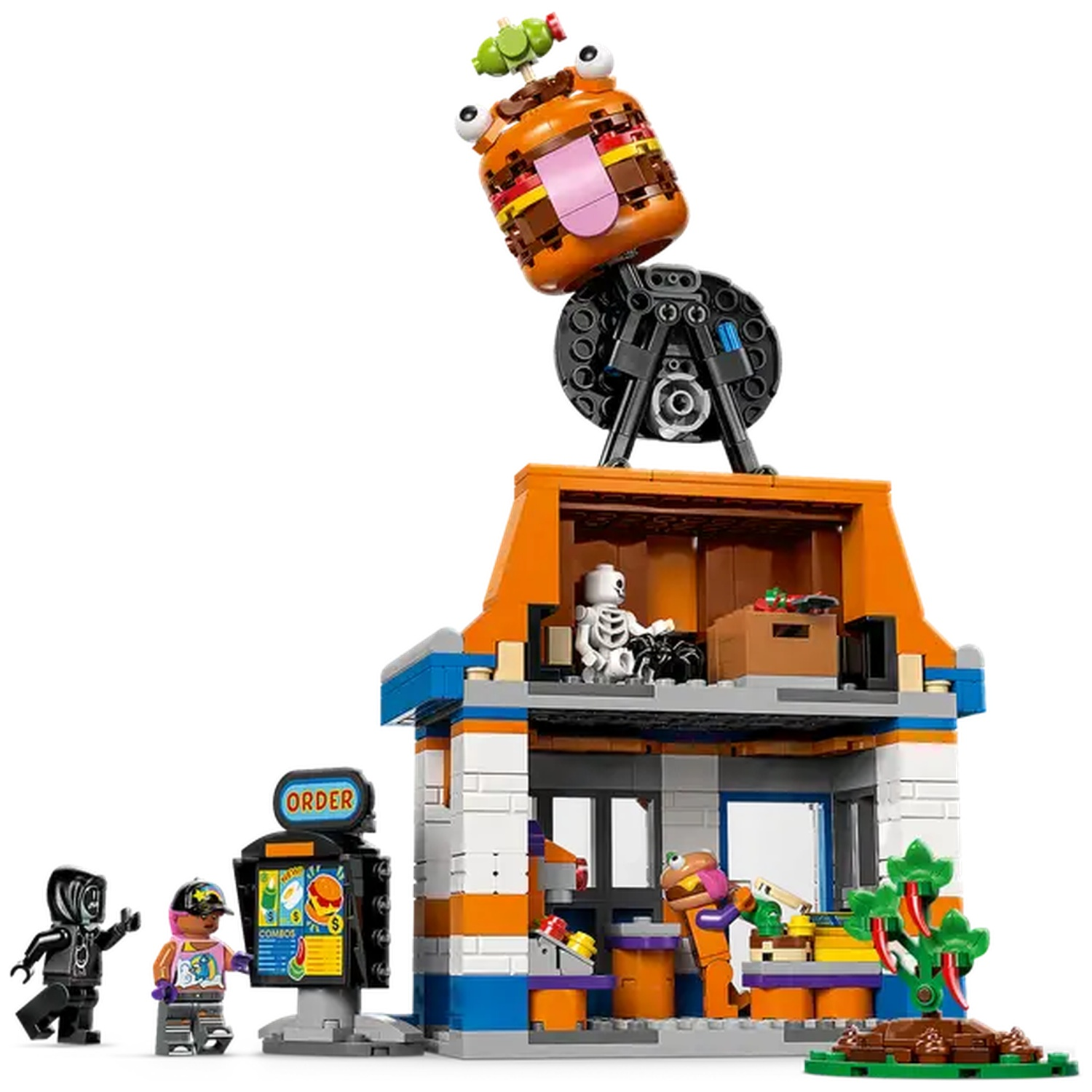 Ensemble Lego représentant un restaurant de burgers avec des figurines et un burger géant sur le dessus. Inclut un kiosque de commande et un petit arbre.