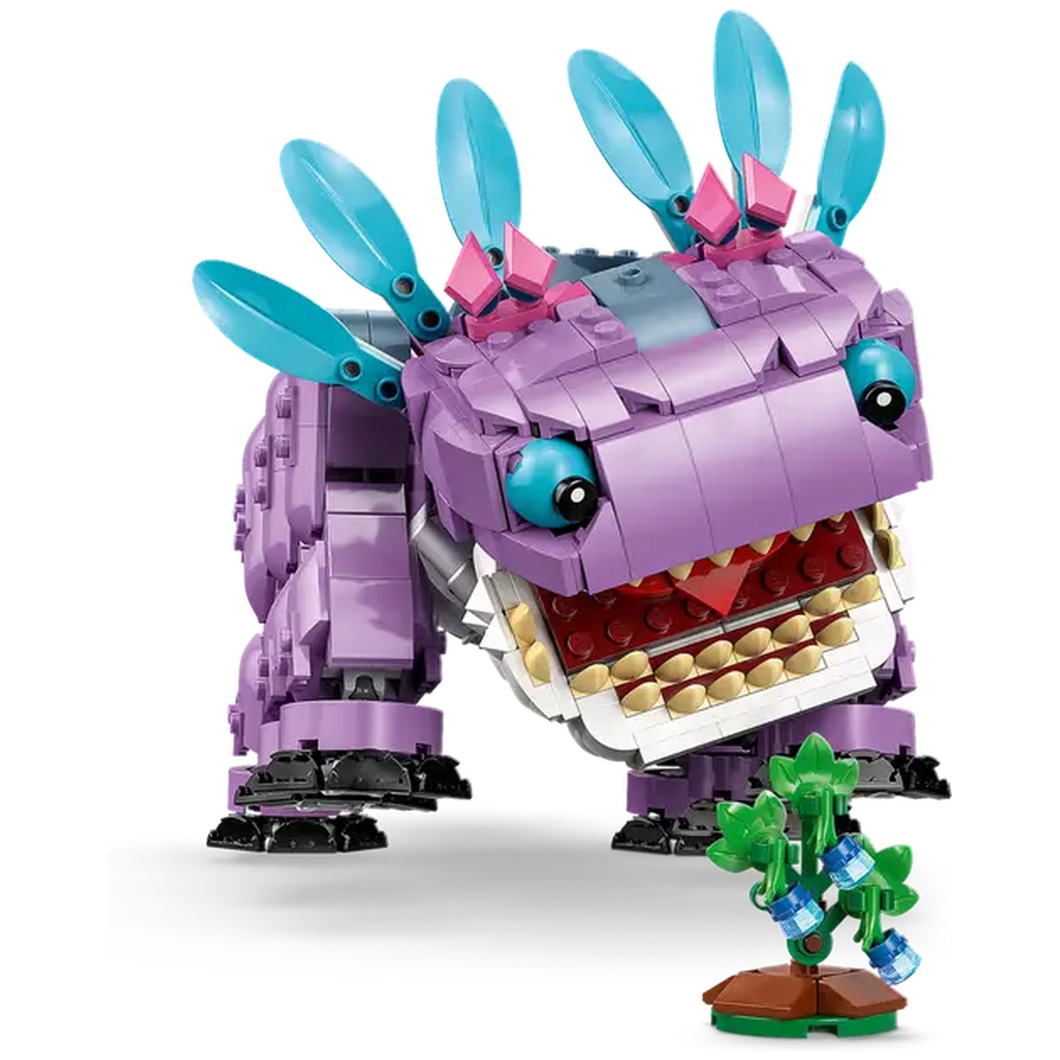 Een paars Lego-wezen met blauwe accenten, grote tanden en een kleine plant. Het wezen heeft grote blauwe ogen en een wijd open mond.