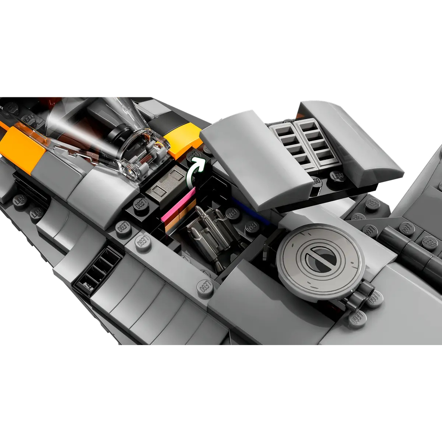 A gray Lego spaceship with open hatches, revealing internal components and details. Features orange, black, and silver elements.