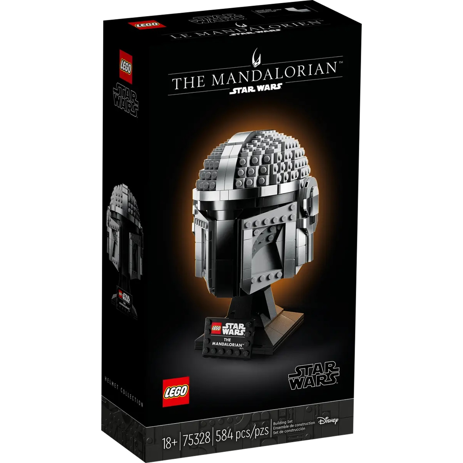 Een Lego-doos toont een Mandalorian-helm. De doos is zwart met Lego- en Star Wars-logo's. De helm is grijs en staat op een zwarte standaard.