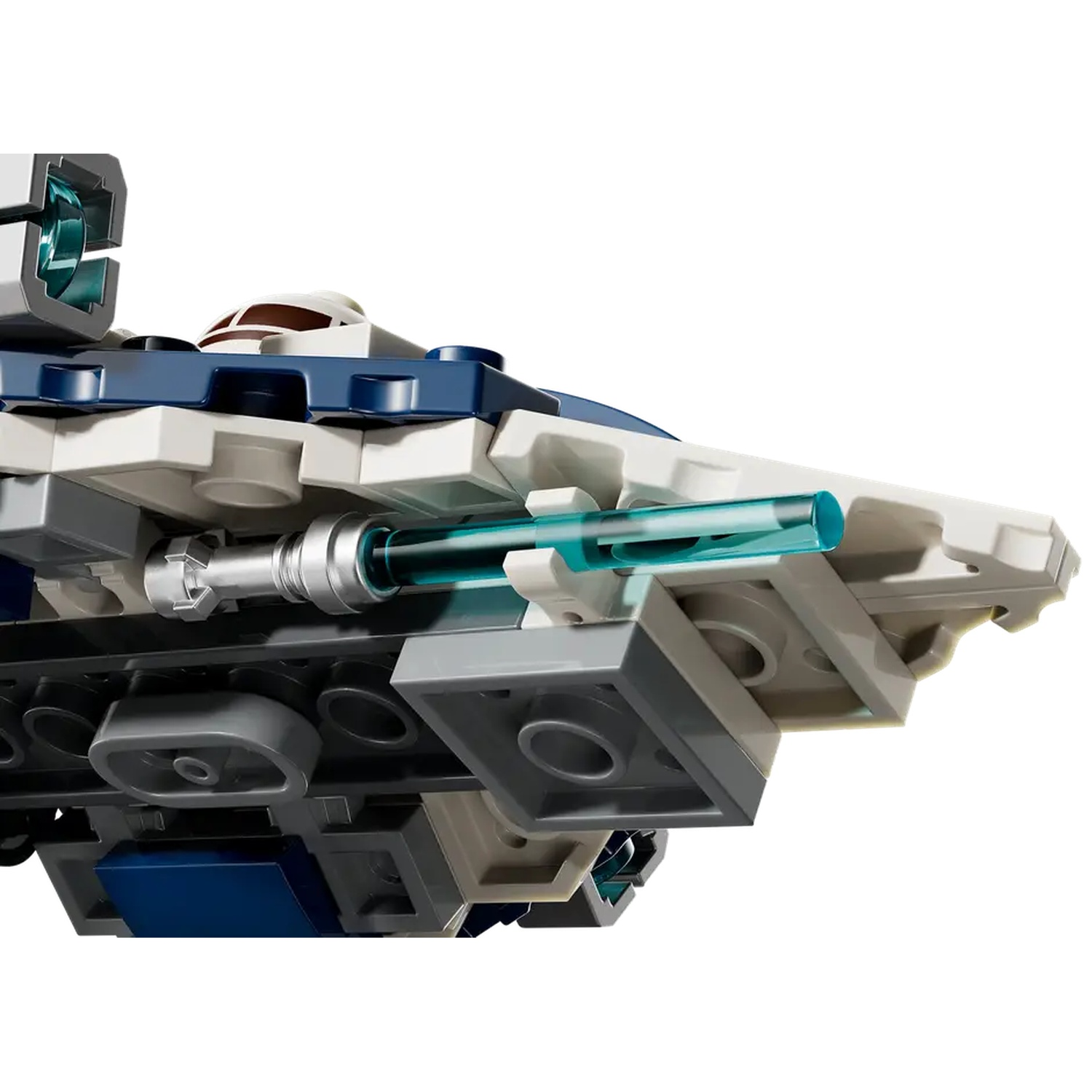 Close-up of a Lego spaceship. Blue, white, and gray blocks are visible, with a clear tube and a cockpit area. White background.