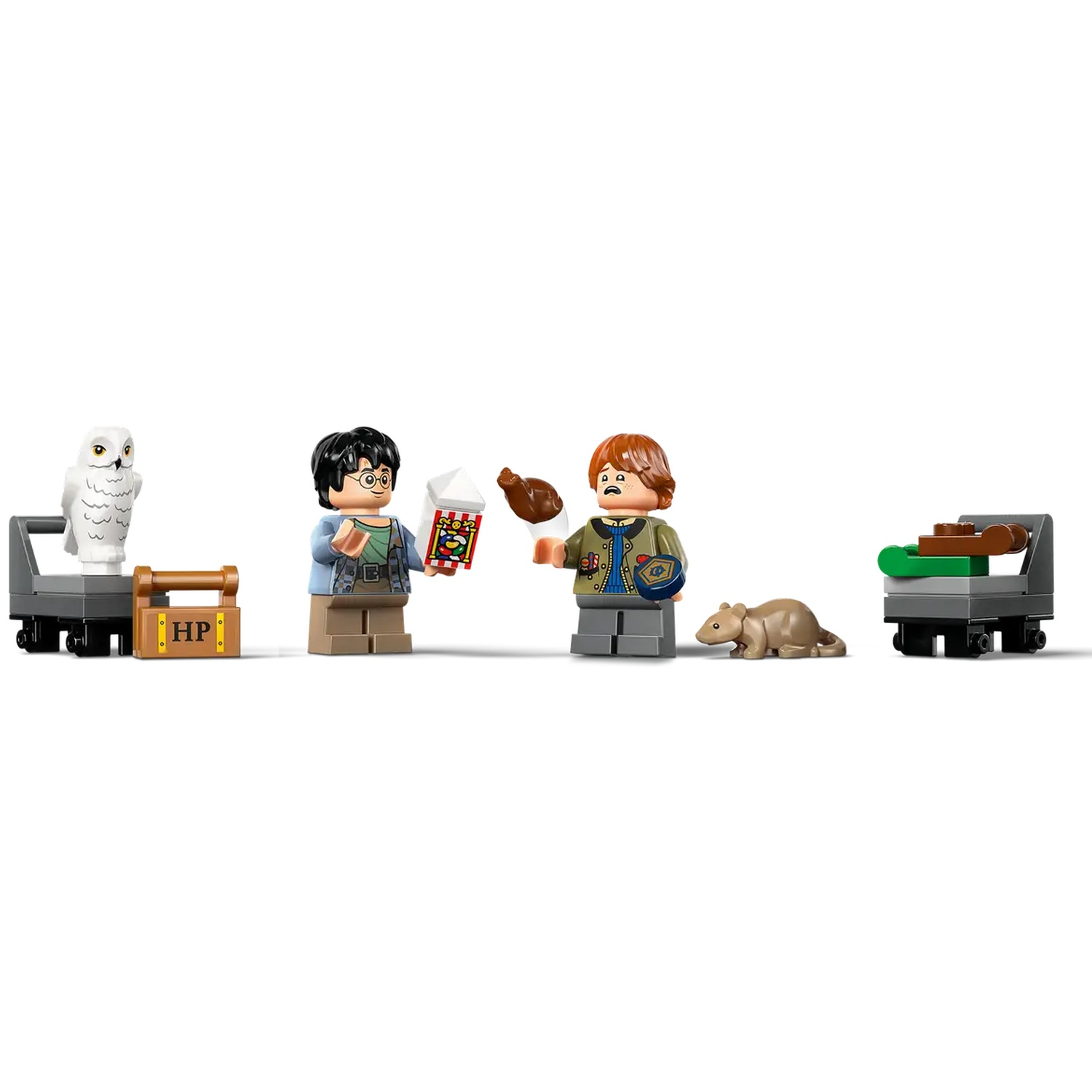 Lego set with Harry Potter characters. Includes Harry, Ron, an owl, a rat, and carts with various items like popcorn and a treat.