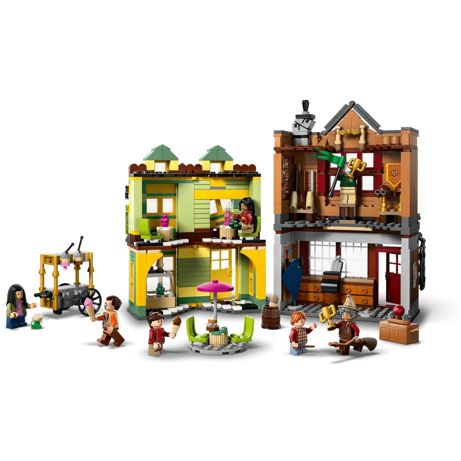 Lego set depicting a scene with buildings, characters, and accessories. Includes ice cream cart, tables, chairs, and figures.