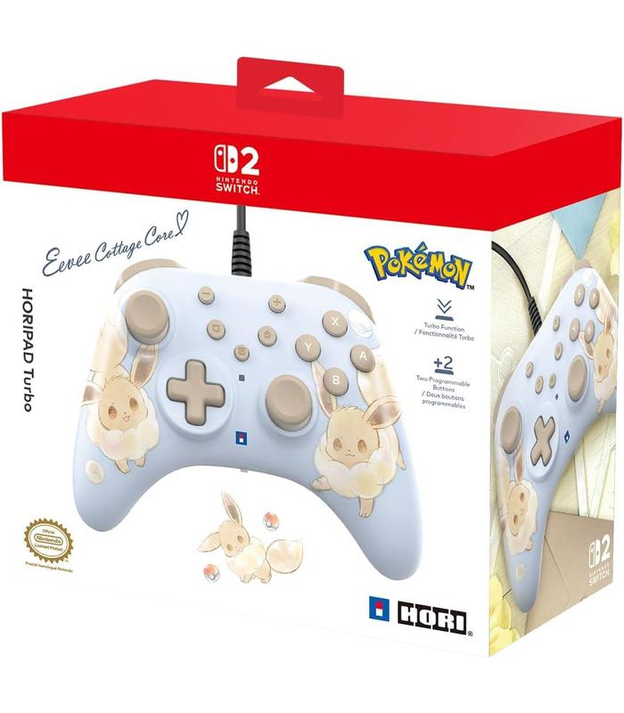 Un controlador de Nintendo Switch en una caja. El controlador es azul claro con diseños de Eevee. La caja es roja y blanca.