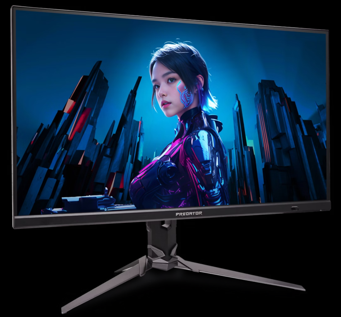 A monitor egy futurisztikus nőt jelenít meg neon akcentussal egy városi háttér előtt. A monitor fekete állvánnyal rendelkezik, a PREDATOR szóval.