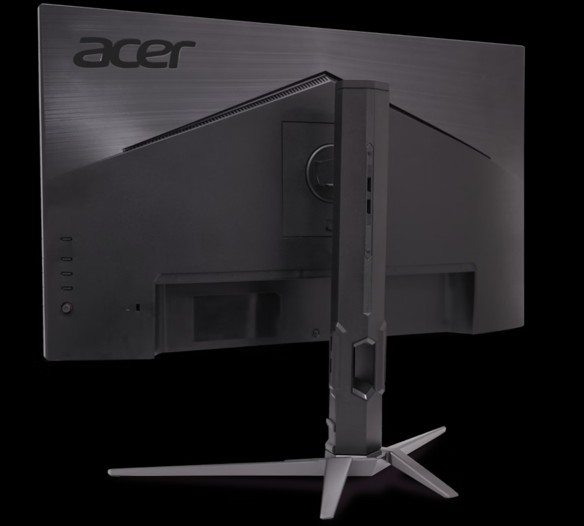 Egy fekete Acer monitor hátulja. Az állvány szürke. Az Acer logó a bal felső sarokban látható. A háttér fekete.