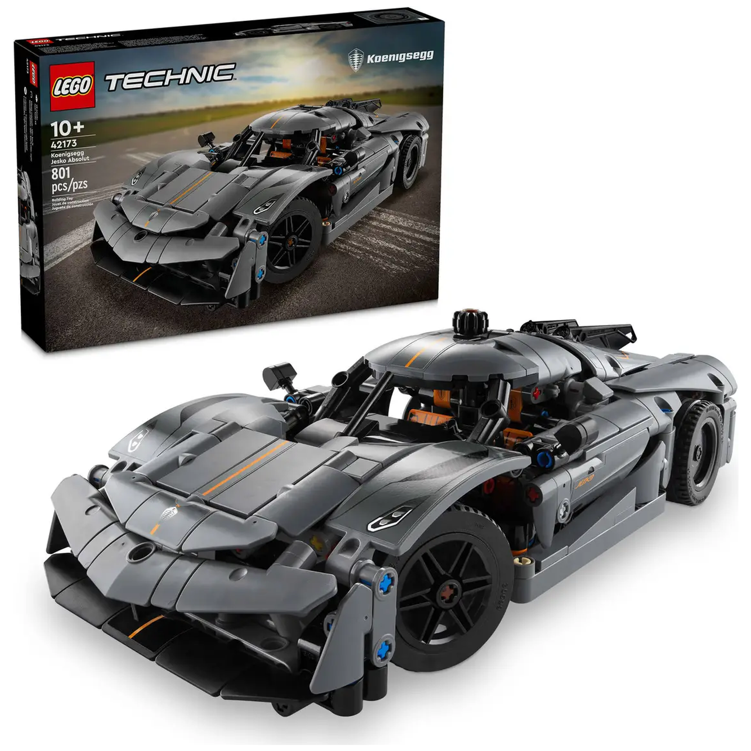 Een Lego Technic Koenigsegg Jesko Absolut automodel. Het is grijs met zwarte wielen en oranje accenten. De doos staat op de achtergrond.