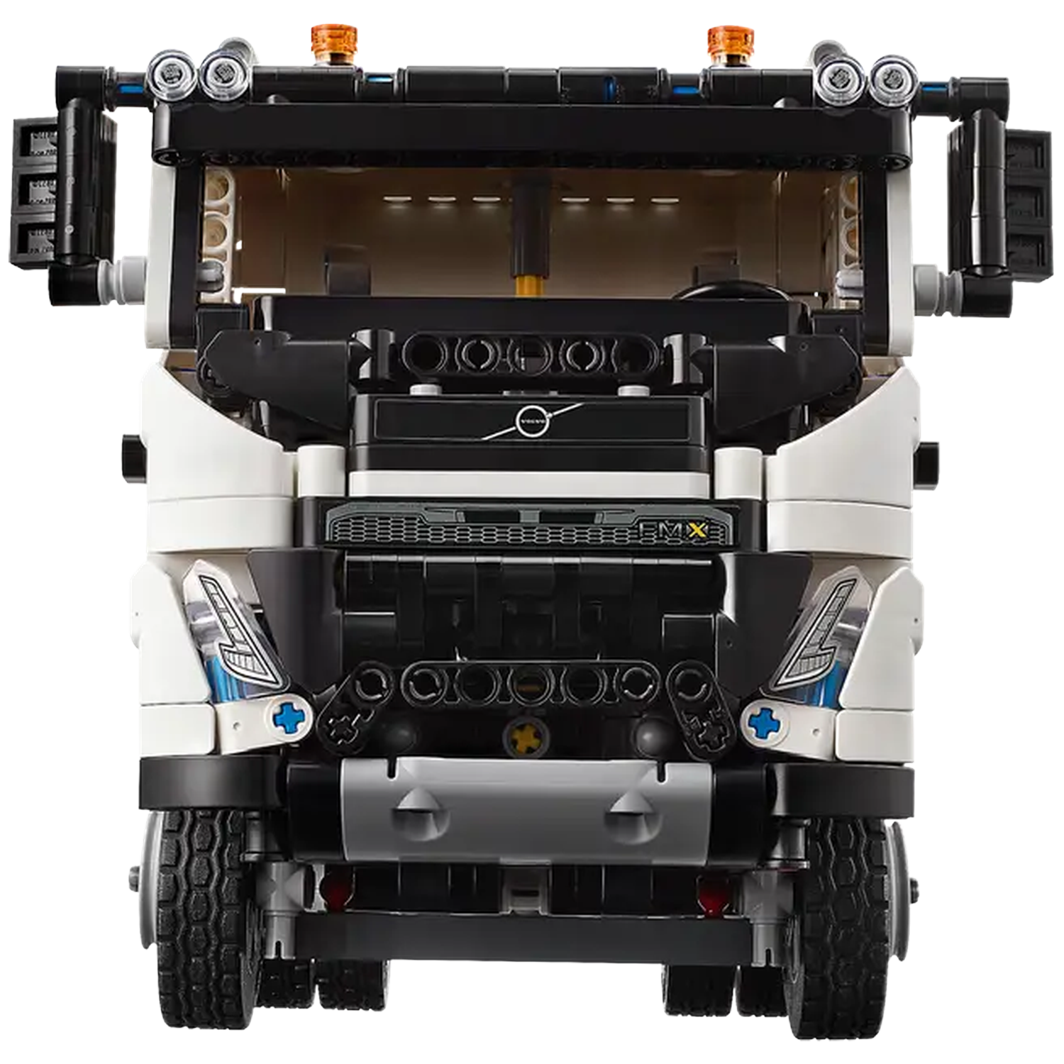 Front view of a white and black Lego truck. It has black wheels, lights on top, and a Volvo logo.
