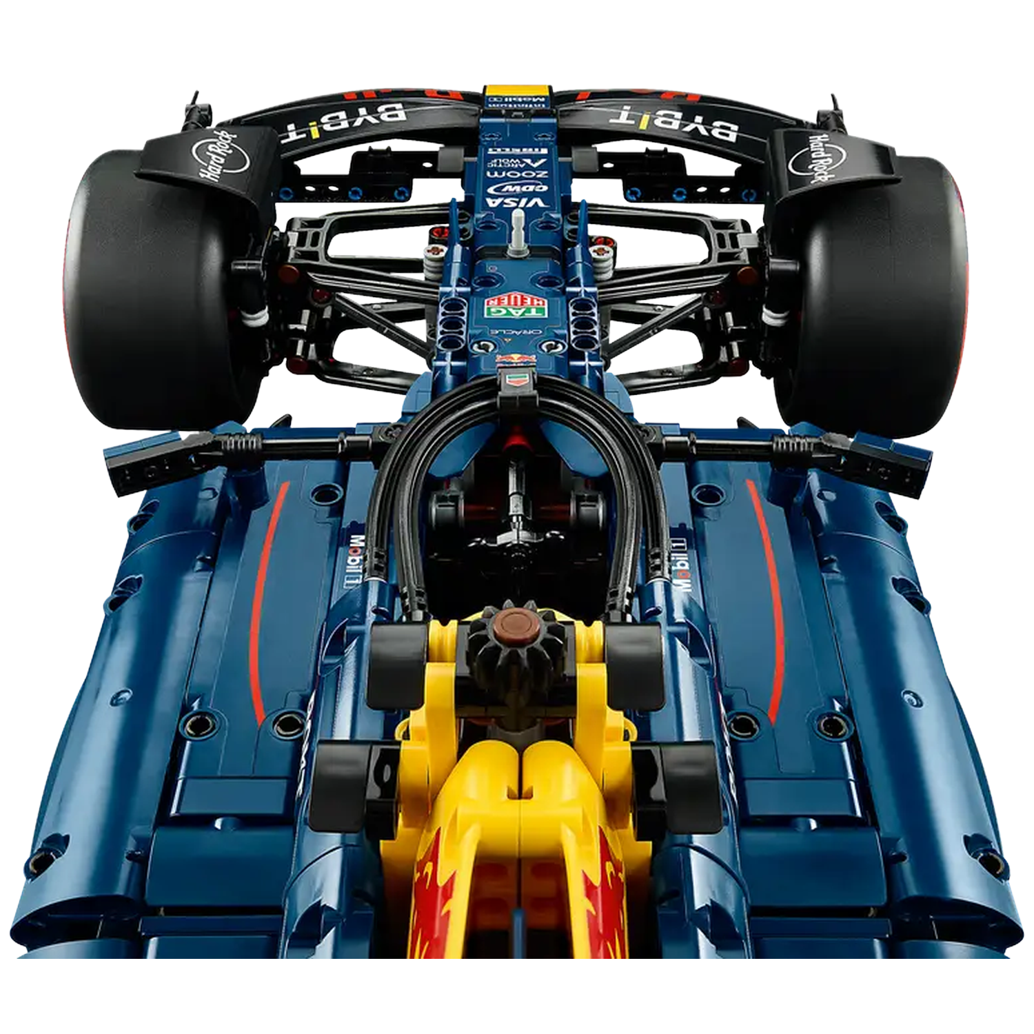 Een blauw-gele Lego F1-auto. Voorzien van prominente wielen, sponsorlogo's en details. De auto staat tegen een witte achtergrond.