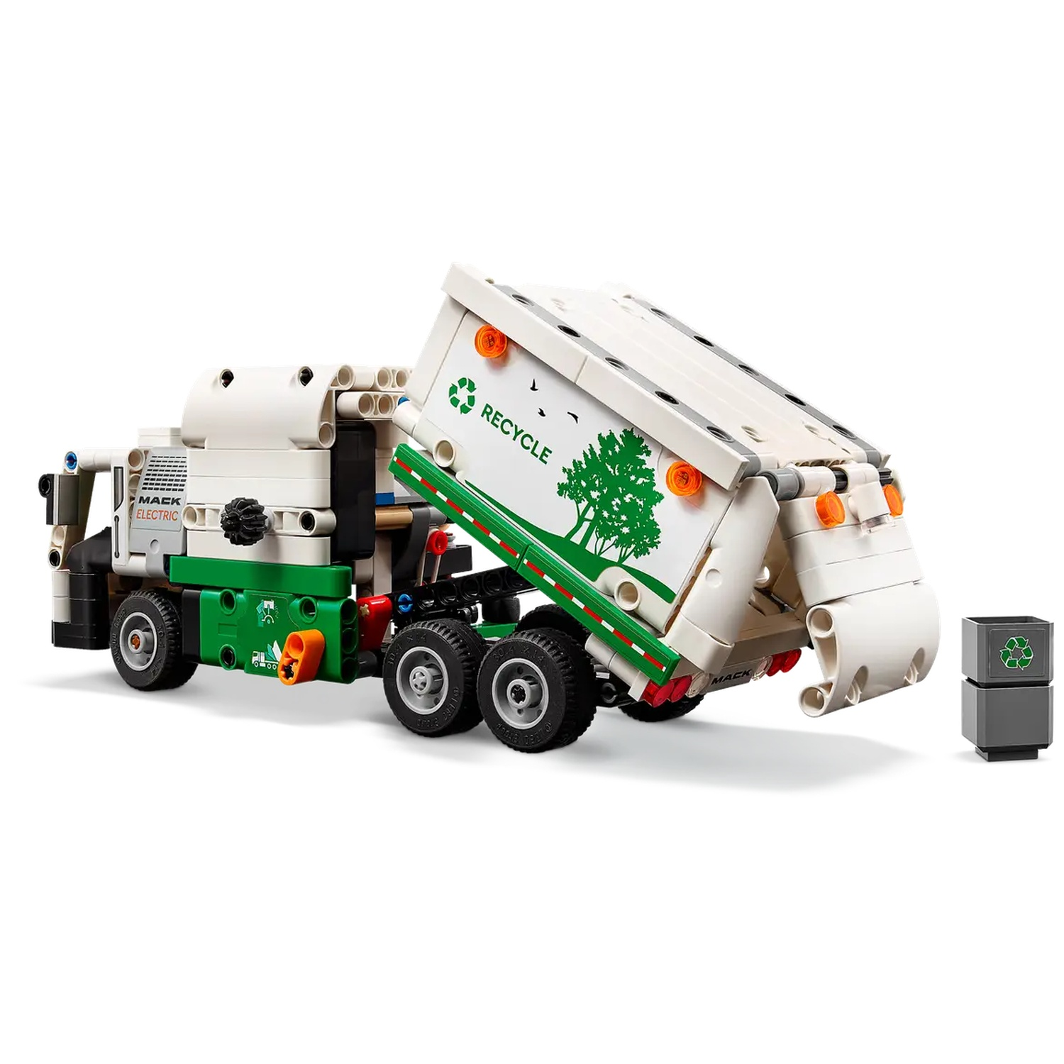 A white and green LEGO Mack electric garbage truck with recycle bin. The truck is lifting its container. The bin is next to it.