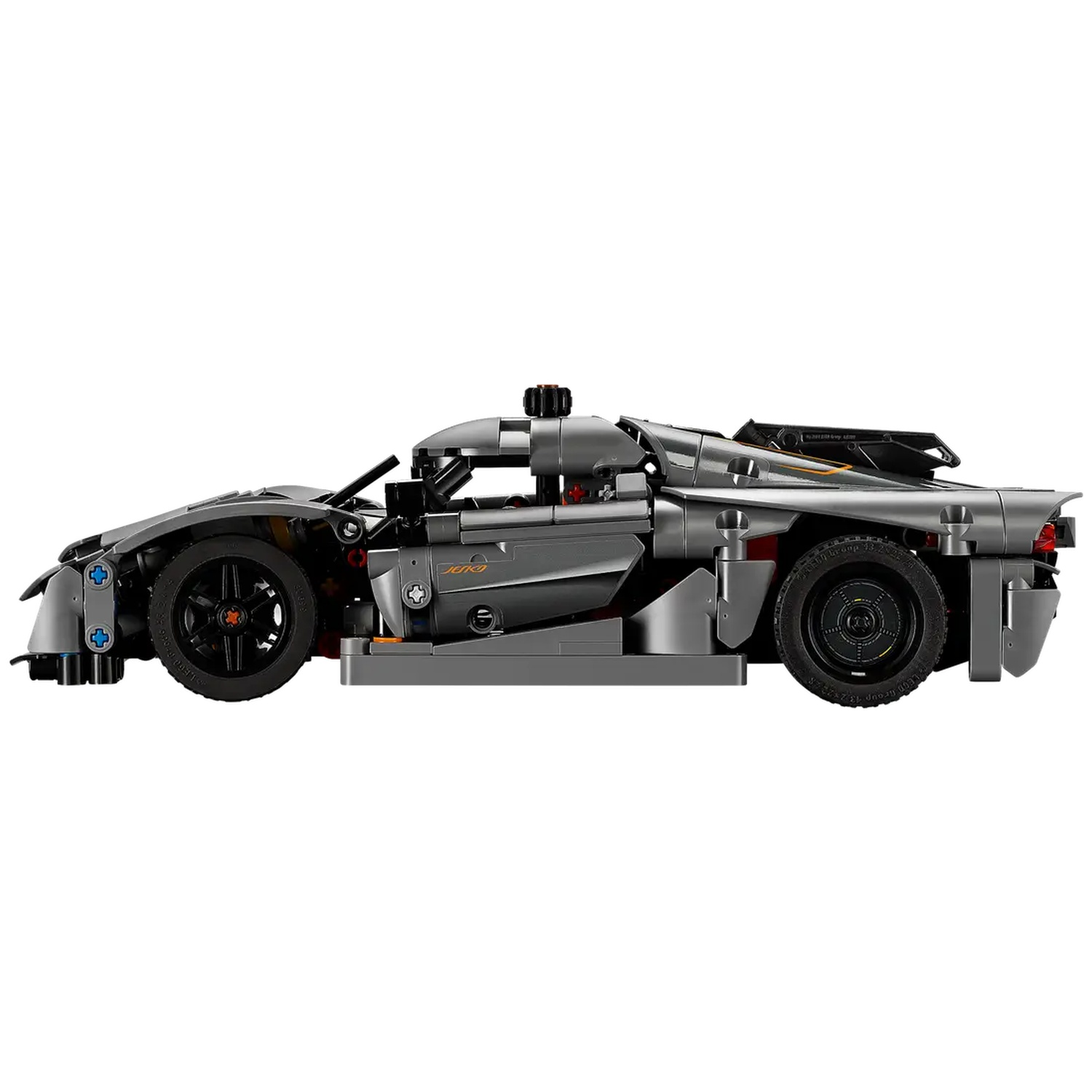 A gray Lego car model with black wheels, set against a white background. The car is sleek, with a detailed design.