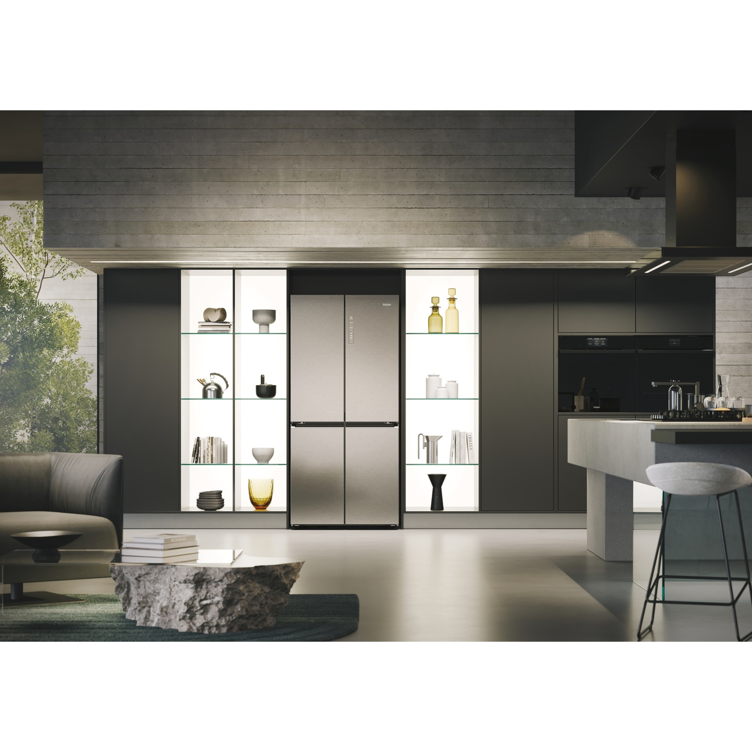 Cucina moderna con frigorifero in acciaio inox, armadi a incasso e piano di lavoro in cemento. Include un tavolino in pietra e uno sgabello da bar.