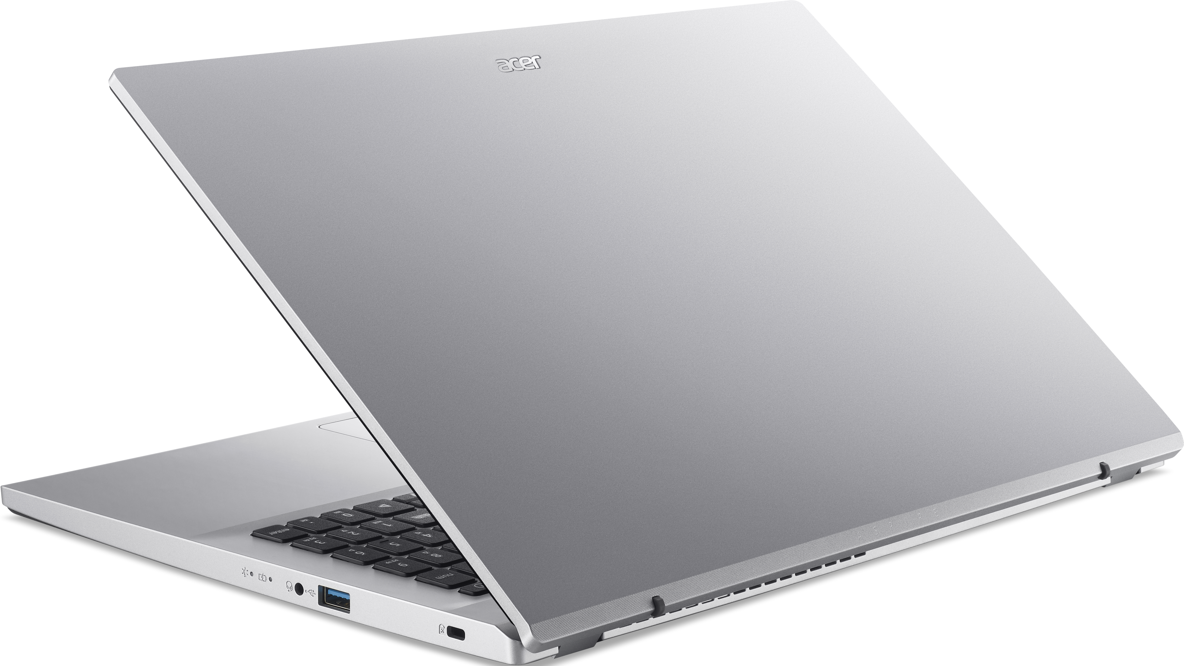 Ordinateur portable Acer argenté ouvert sur fond noir. Le clavier est visible, avec l'écran incliné vers le haut.