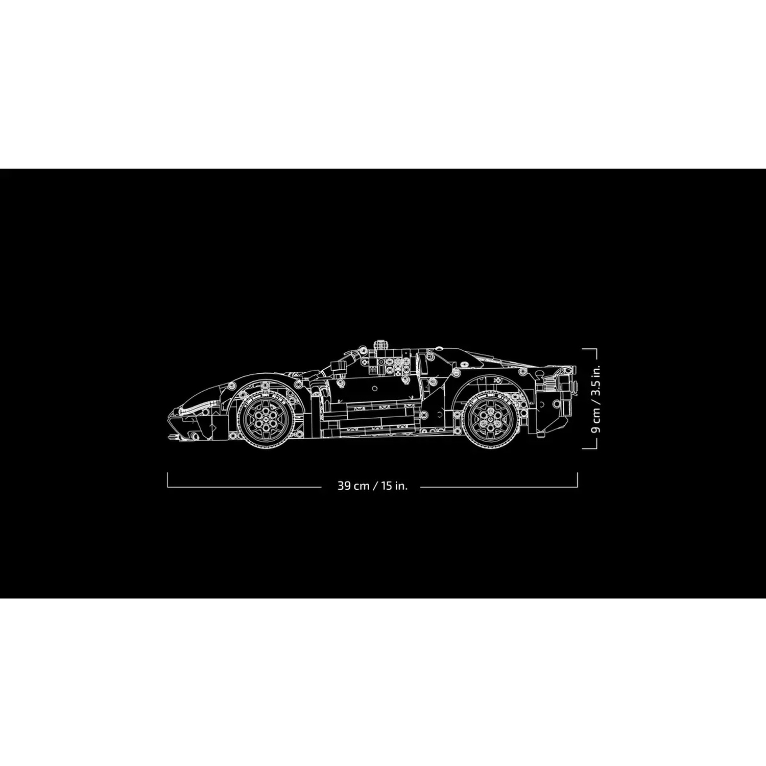 A white outline of a sports car is on a black background. Dimensions: 39cm/15in long, 9cm/3.5in high. Detailed design visible.