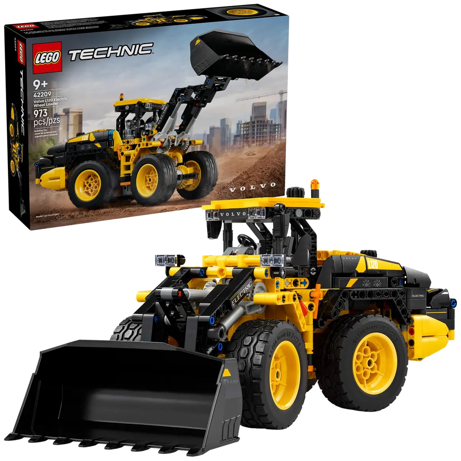 A Lego Technic Volvo L120 electric wheel loader toy. It is yellow and black, with large wheels and a front bucket. The box is also visible.