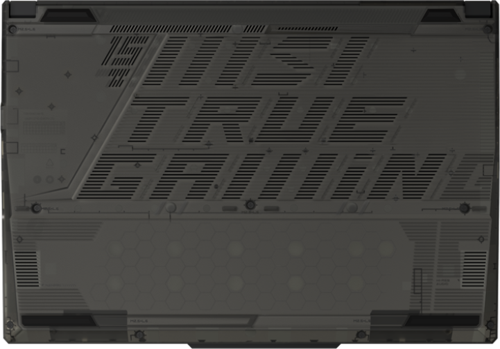 A képen egy szürke laptop alja látható. A 'JUST TRUE GAMING' felirat és egy méhsejtmintázat látható.