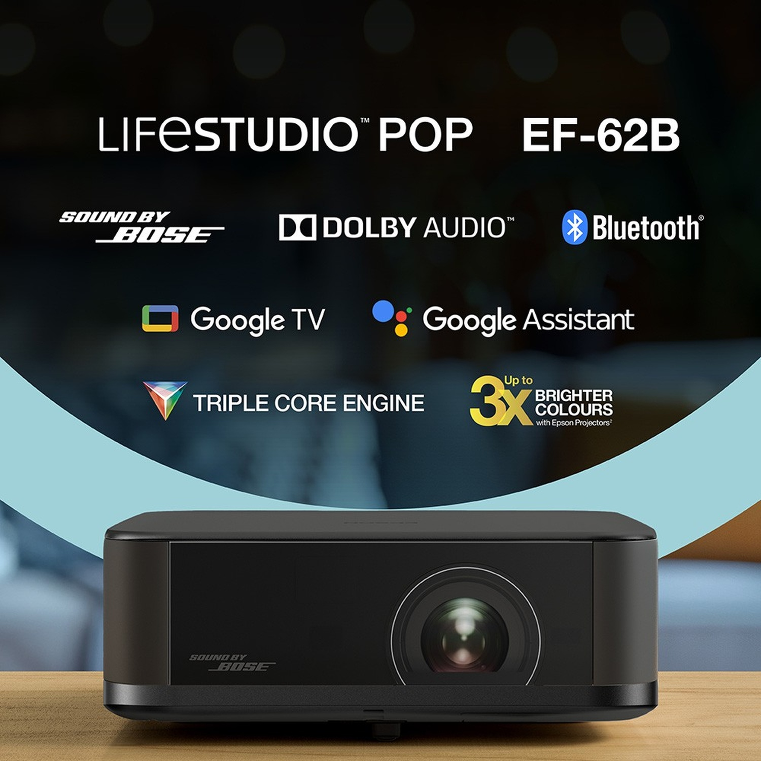 Un proiettore nero su legno. Testo: 'LIFESTUDIO POP', 'SOUND BY BOSE' e 'Google TV'.
