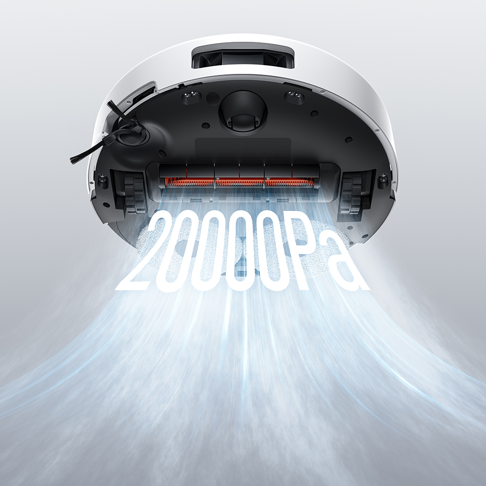 Vue de dessous d'un aspirateur robot blanc. Une étiquette indique "20000Pa" avec un flux d'air bleu. L'aspirateur a une brosse et des roues noires.