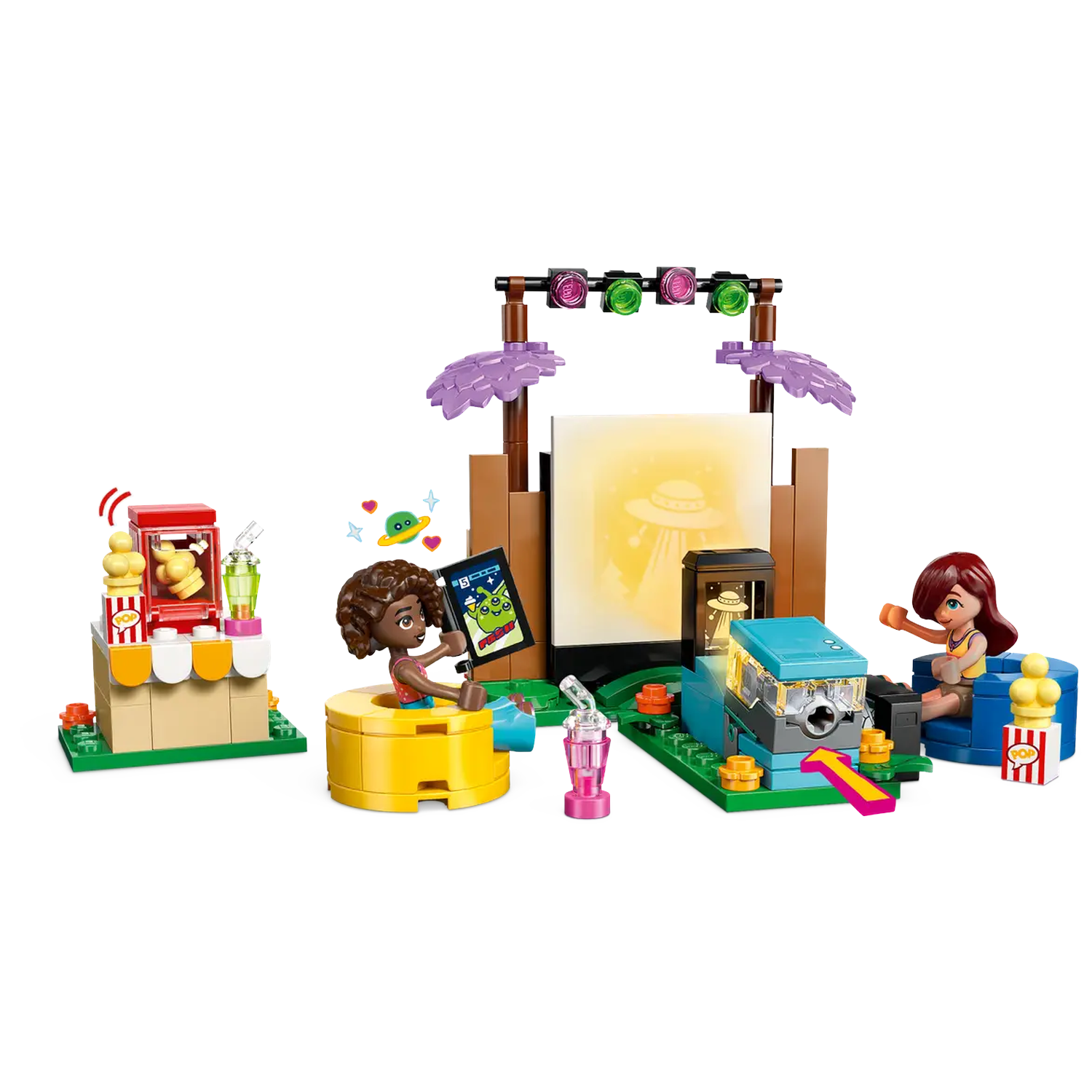 Lego set with three figures, popcorn stand, and a screen showing an alien. Colorful lights and details create a playful scene.