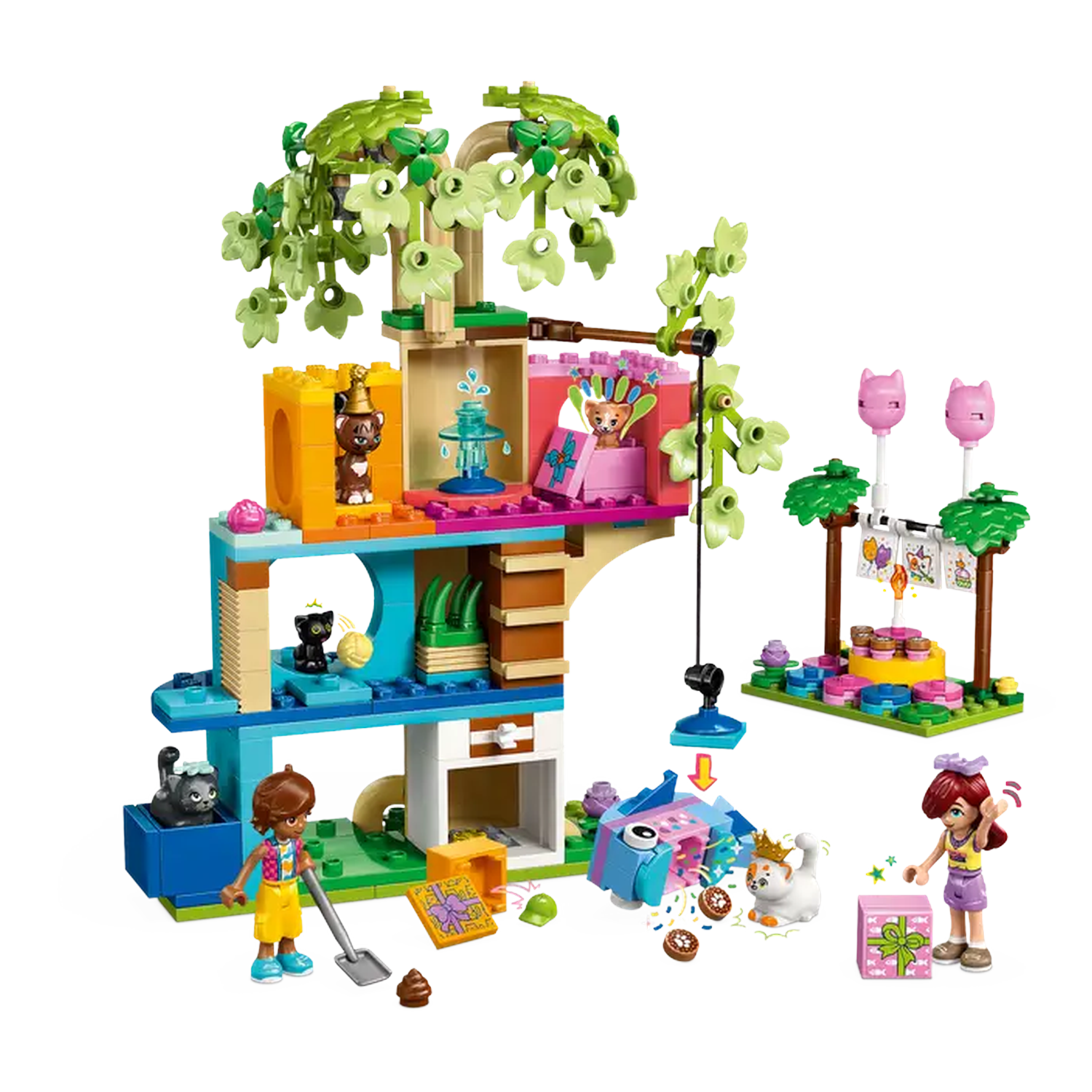 A Lego set with a treehouse, figures, and animals. There's a cat with a crown, a girl with a shovel, and a birthday cake.