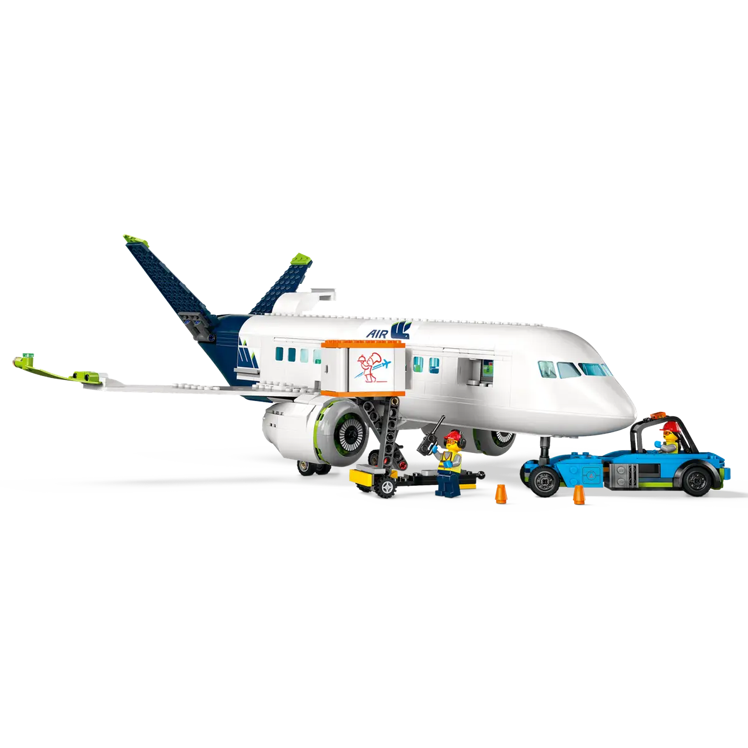 A white airplane toy with blue accents. There are two toy figures and a small blue car toy. The plane is on the ground.