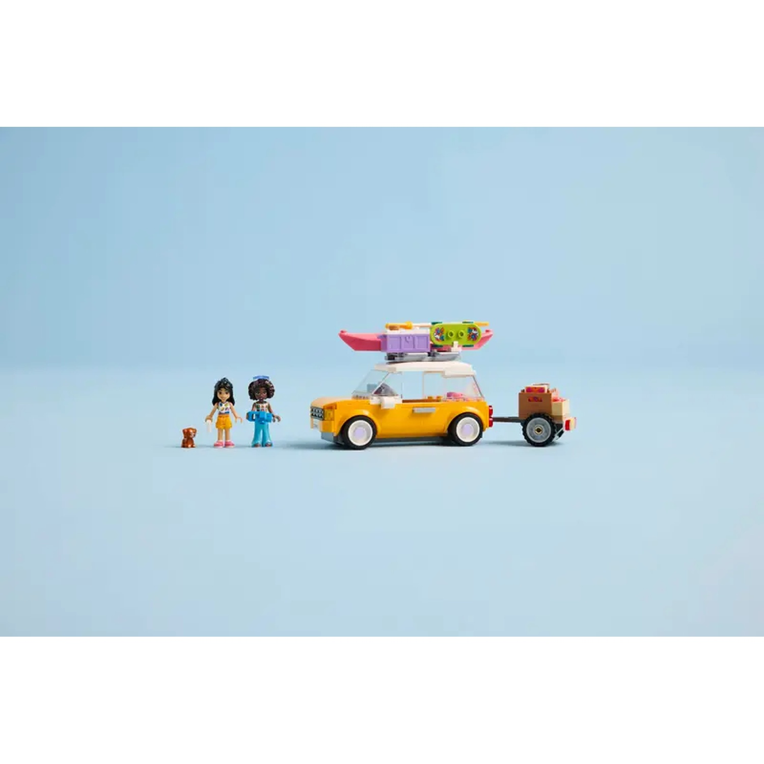 A yellow car with a trailer, two figures, and a dog on a blue background. The car has a kayak on top.