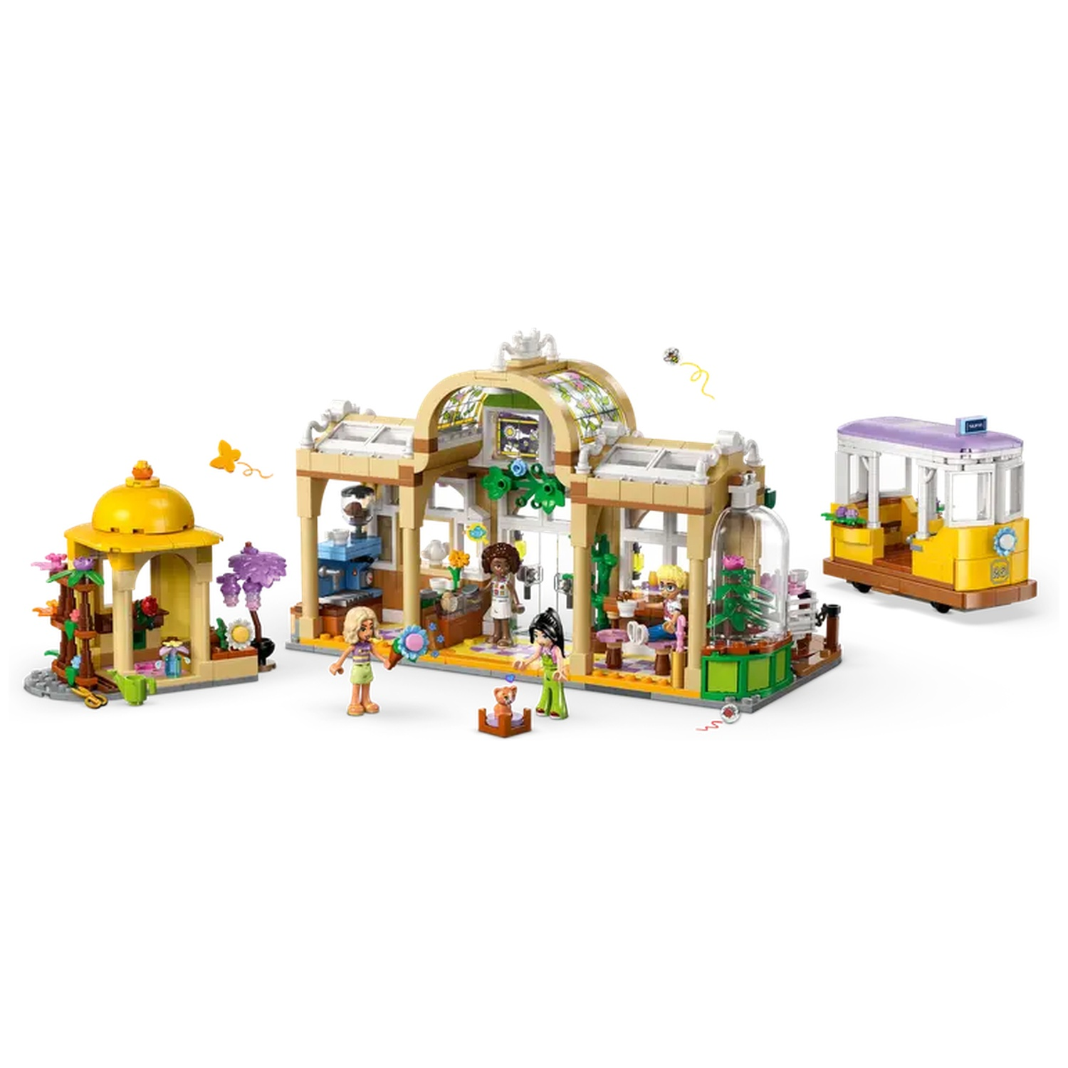 Lego set depicting a botanical garden with figures, a yellow tram, and a small gazebo. Various plants are visible.