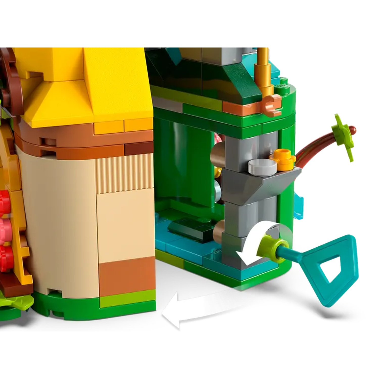 Une structure Lego avec des parties jaunes et vertes. Une flèche blanche pointe vers une poignée turquoise. Le fond est blanc.