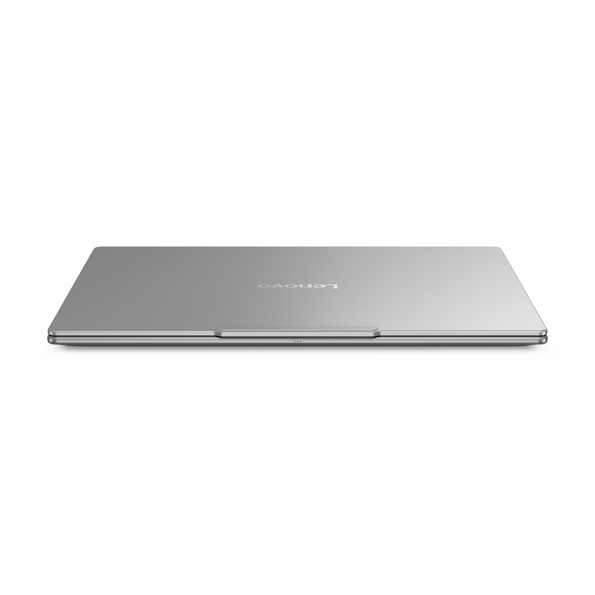 Ein silberner Lenovo-Laptop wird von oben gezeigt. Das Lenovo-Logo ist sichtbar. Der Hintergrund ist schwarz.