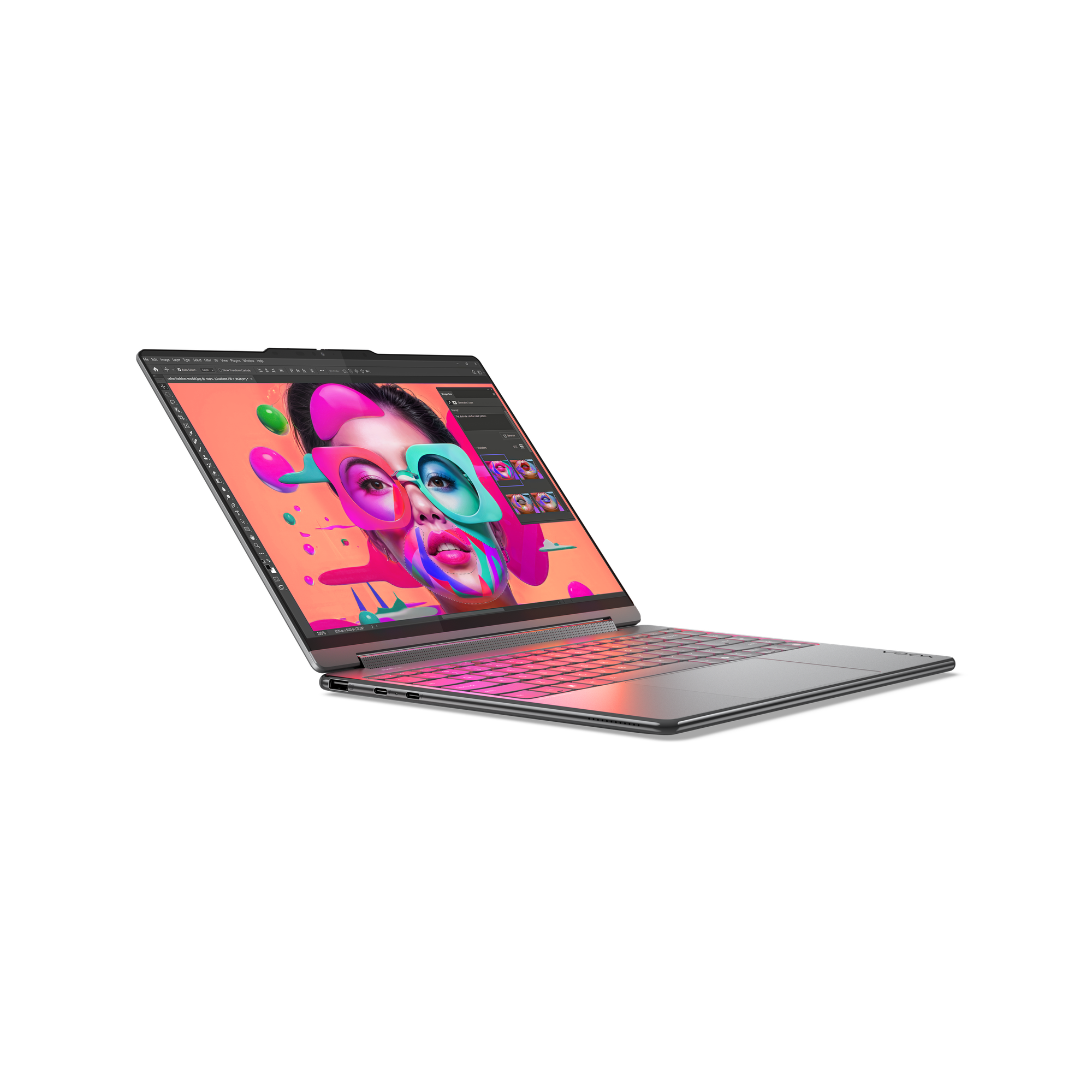 Laptop zeigt farbenfrohes Gesichtsdesign. Der Bildschirm zeigt eine Bearbeitungssoftware. Die Tastatur leuchtet pink. Schwarzer Hintergrund.