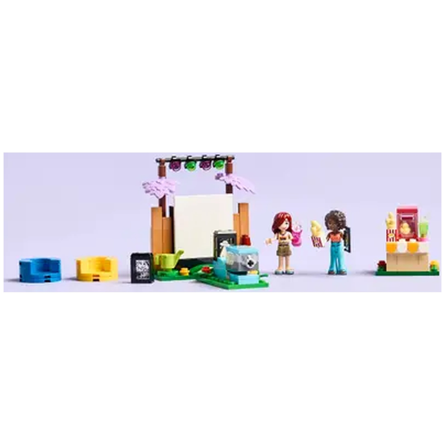 Lego set with two figures, a stage, and other constructions. Figures are holding ice cream. Various colored blocks are on display.