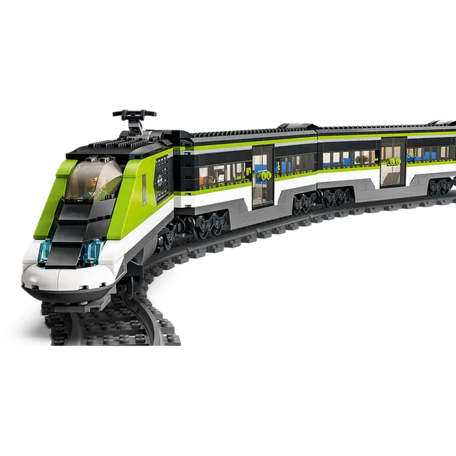 A toy train, green and black, on tracks. The train has multiple cars with windows, and is on a slight curve.