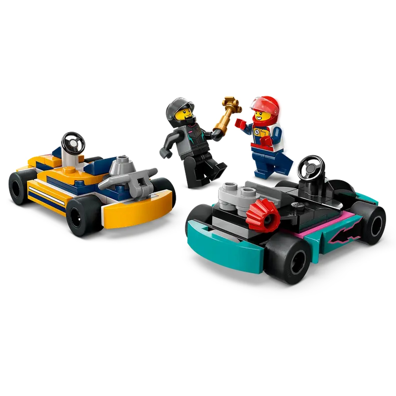 Lego set with three go-karts and two Lego figures. One figure holds a golden trophy, the other has a red helmet. 
