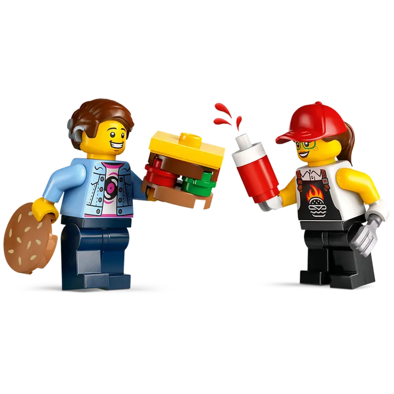 Two Lego figures: One holding a burger, the other a sauce bottle. One wears a cap and apron. Burger has layers.