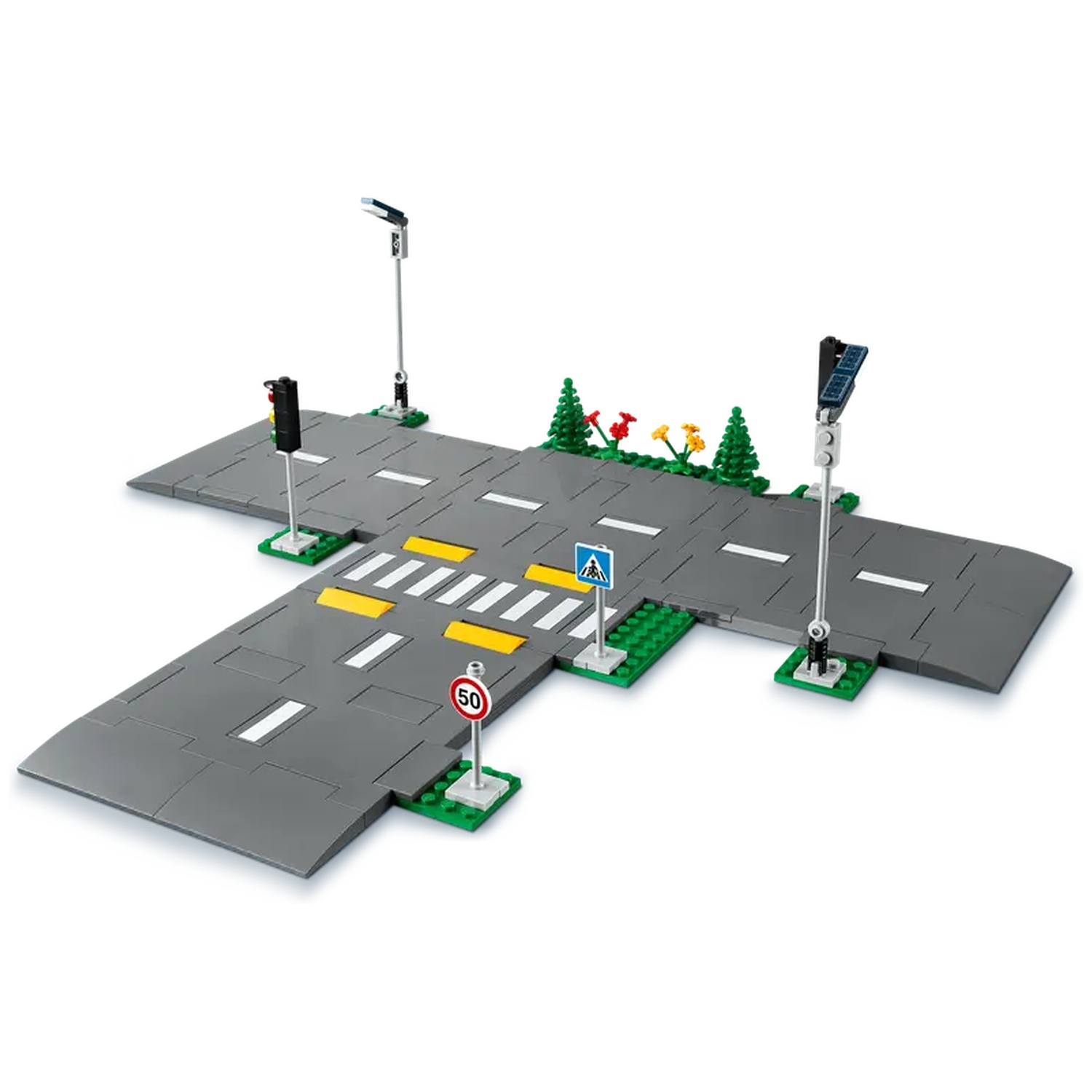 A Lego intersection with crosswalk, traffic lights, and street signs, including a speed limit sign. Trees and solar panels are present.
