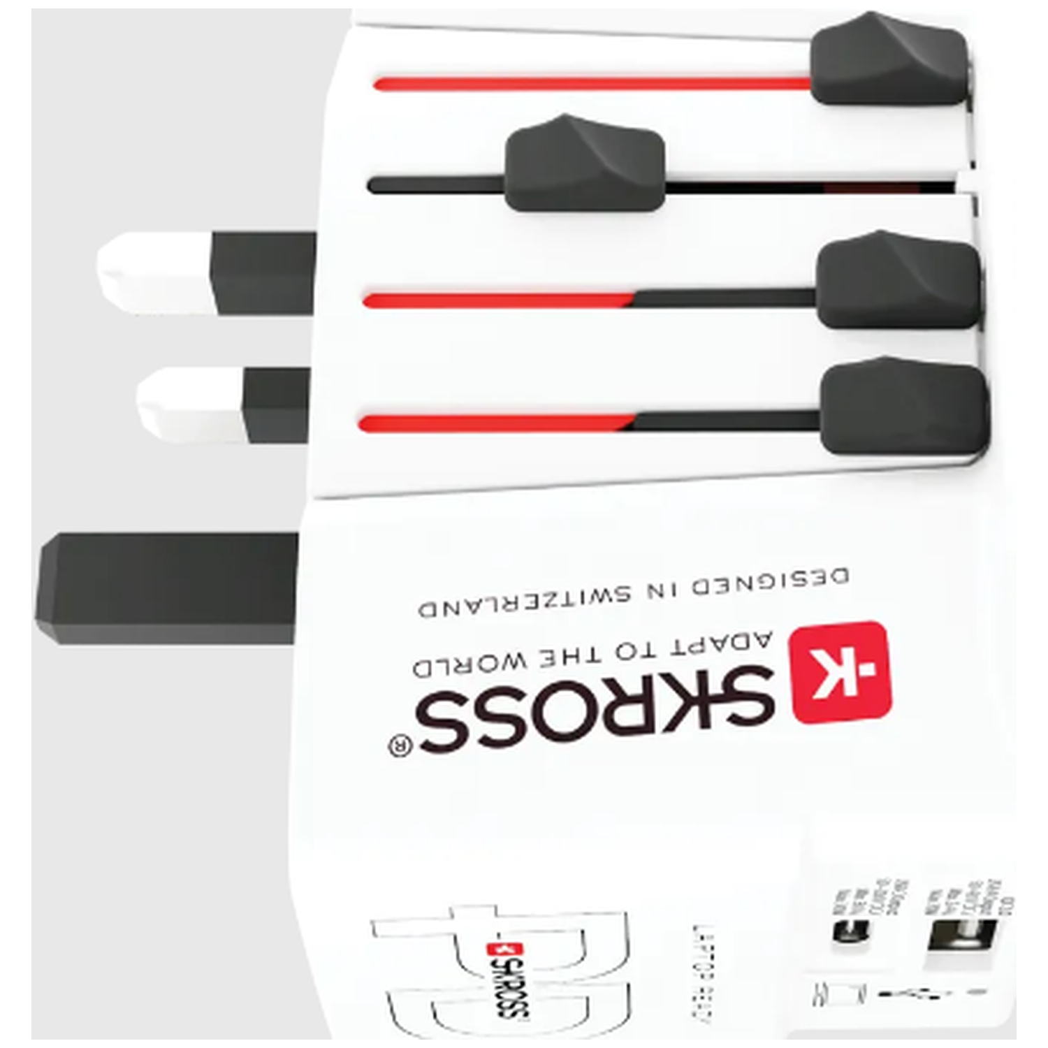 White and black travel adapter with red accents and black sliders. The brand SKROSS is visible.