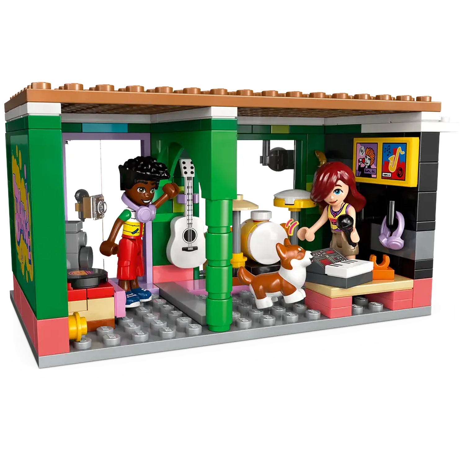 Lego music studio scene. Two figures, a guitar, drums, keyboard, and a dog are present. Colorful walls and posters are visible.