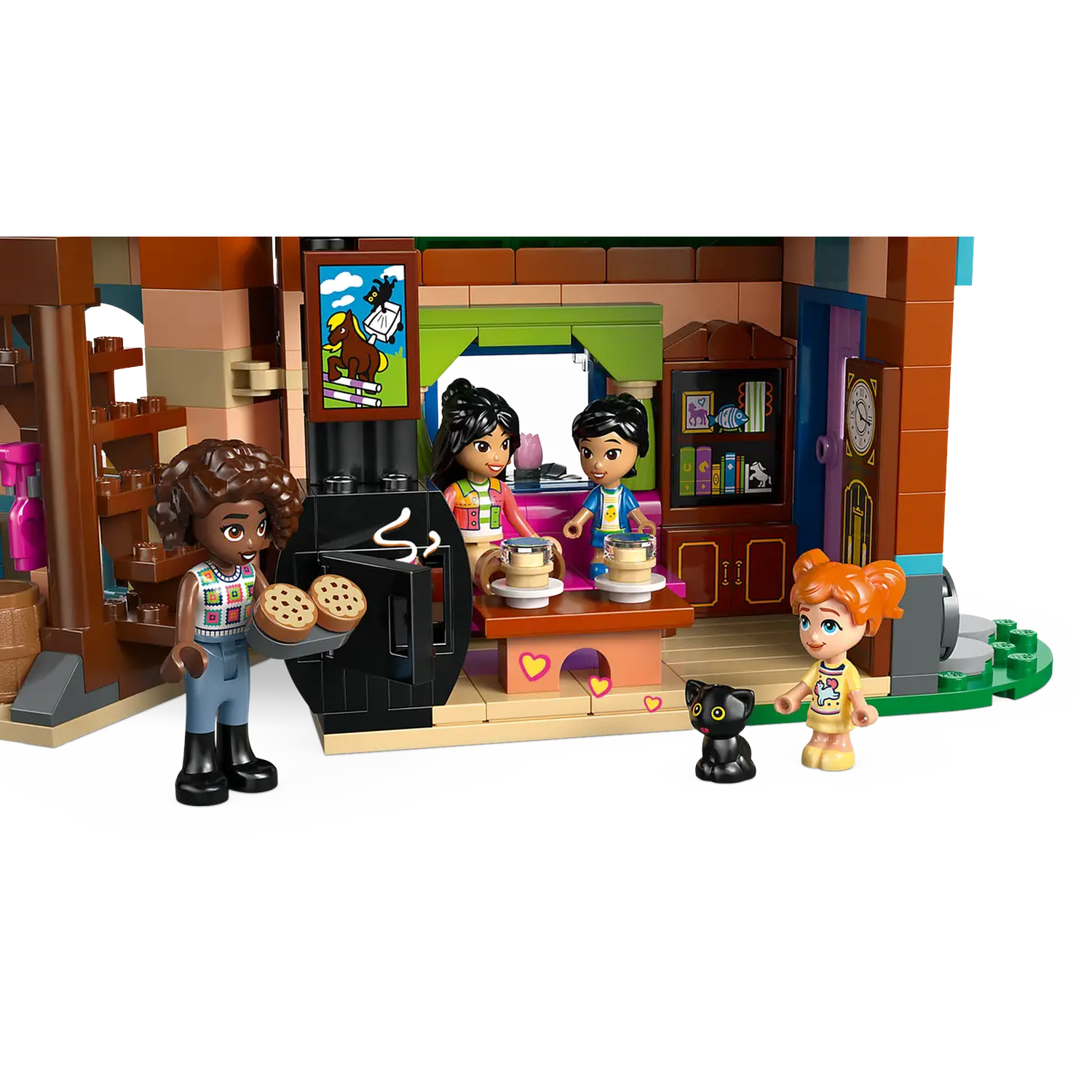 Lego set depicts a kitchen scene. Figures are present, including a person holding cookies. Cat and other figures are also visible.