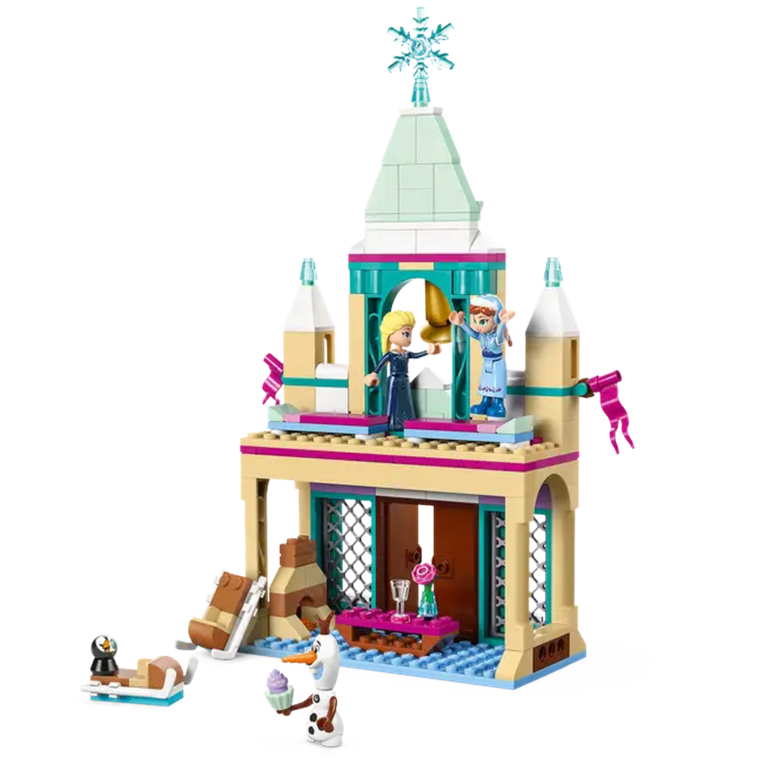 Lego set of a castle with Elsa and Anna figures. Olaf holds a cupcake. There's a penguin on a sled.