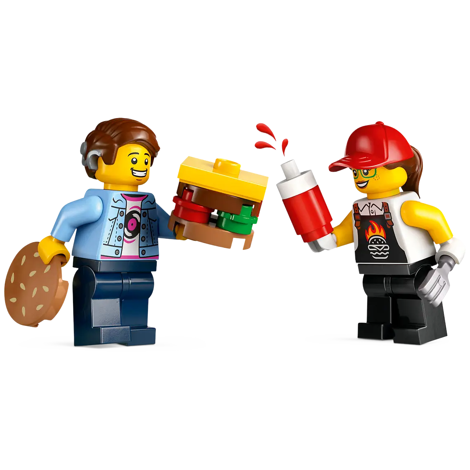 Two Lego figures: One holding a burger, the other squeezing ketchup. One wears a blue jacket, the other a red cap and apron.