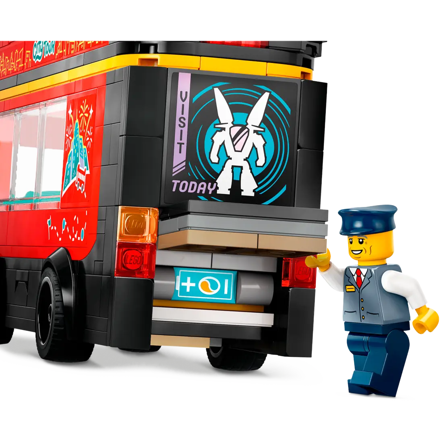 A Lego bus with a driver figurine. The bus has red and black details with a sign that says 'VISIT TODAY'.