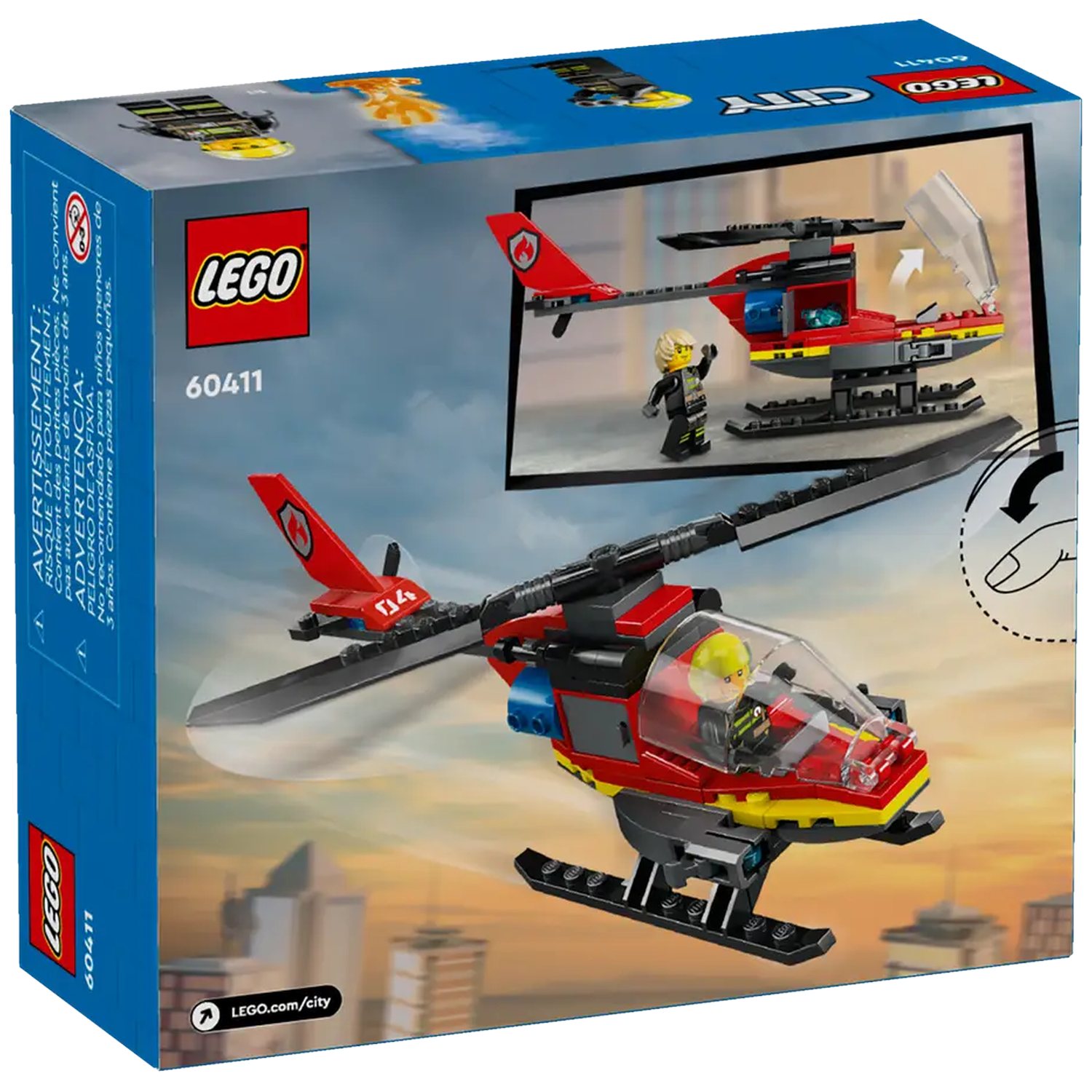 A Lego box shows a red and yellow helicopter with a pilot. The box has a picture of the helicopter and a city scene.