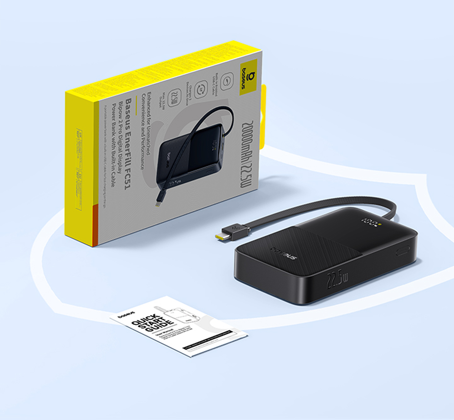 Un power bank negro con cable integrado, una caja y una guía de inicio rápido sobre una superficie azul. La caja es amarilla y gris.
